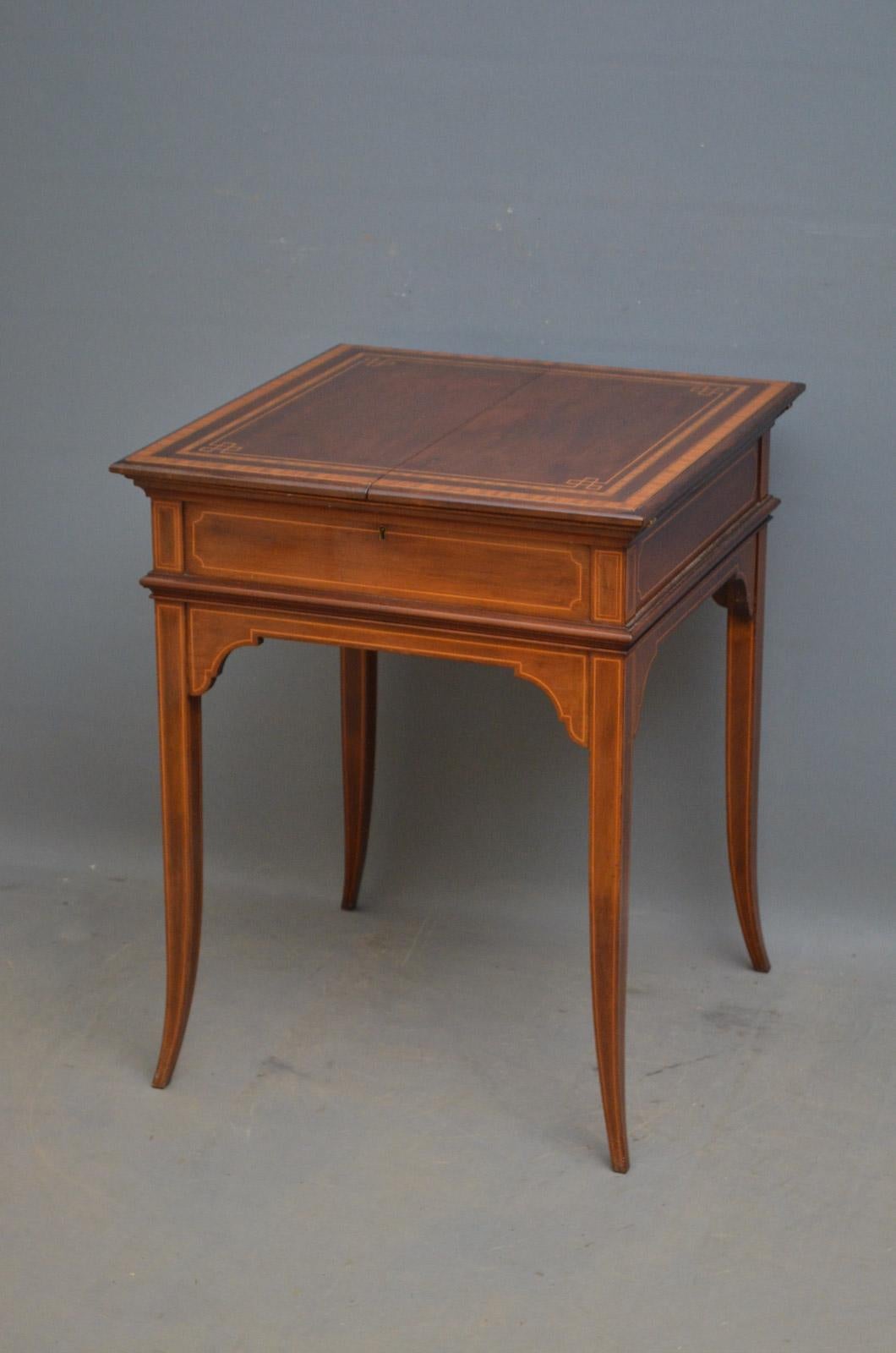 Sn4529, fine quality Edwardian mahogany and satinwood writing table by Maple & Co, having inlaid top which opens to reveal 3 leather panels, ink well with silver tops and silver pen tray above 4 polished and inlaid sides, standing on string inlay,