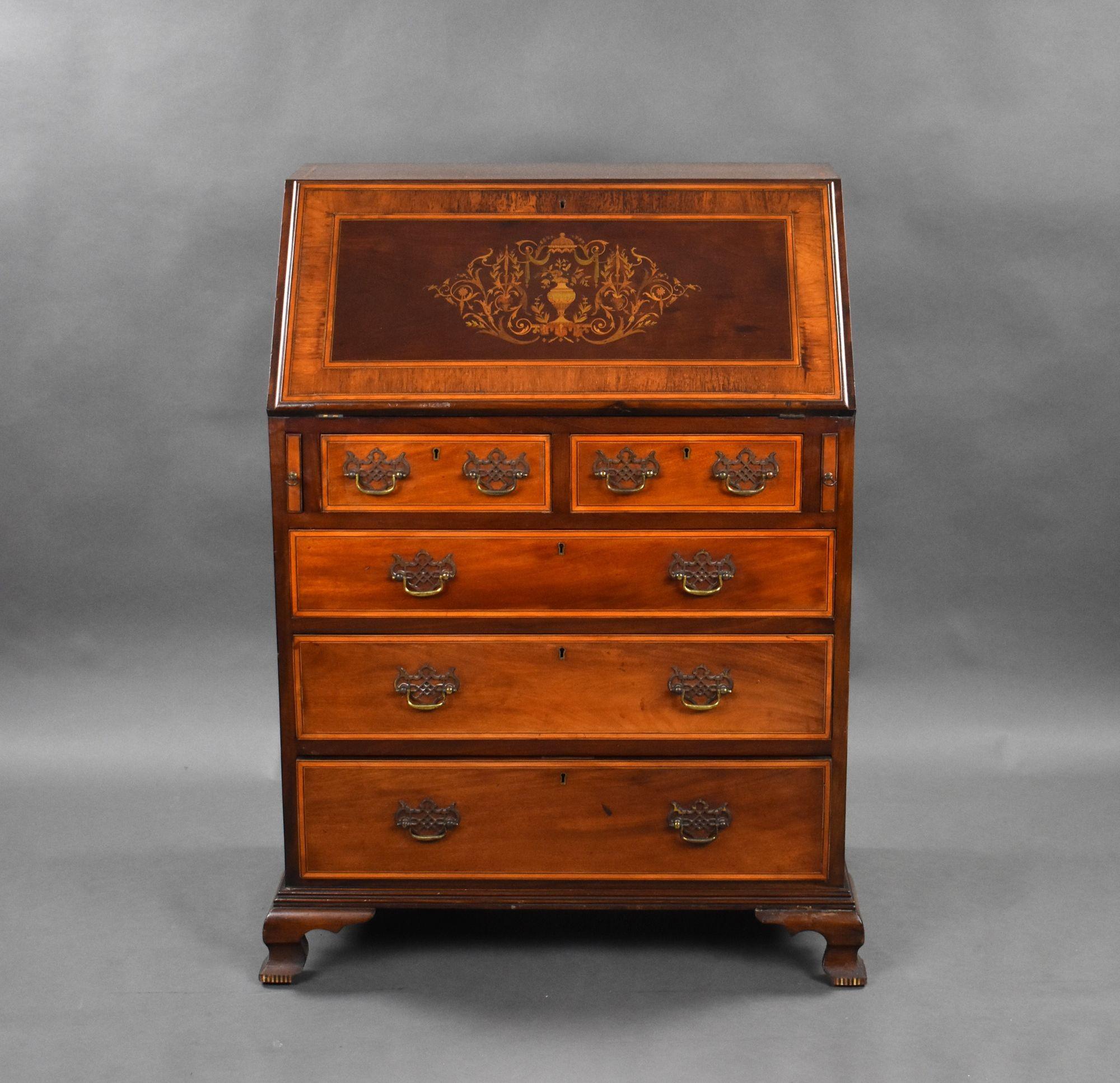 For sale is a good quality Edwardian marquetry bureau, having a cross banded fall, opening to a fully fitted interior consisting of pigoen holes, drawers and a central cupboard. The bureau also has an arrangement of four graduated drawers and stands