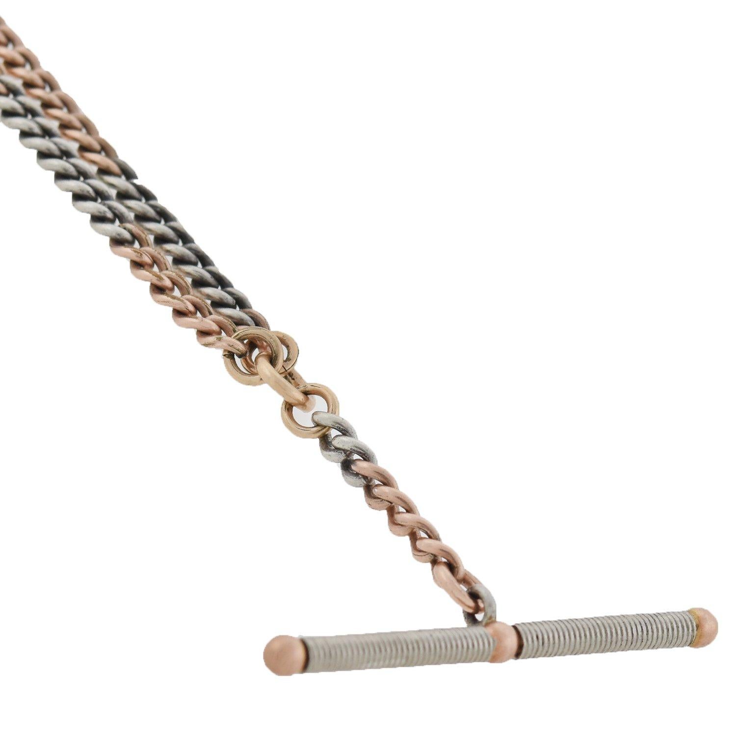 A lovely mixed metals watch chain from the Edwardian (ca1910) era! This beautiful curb link chain features a pattern of 14kt rose gold chain that alternates with sections of platinum links, coming together to create a wonderful two-tone appeal. A