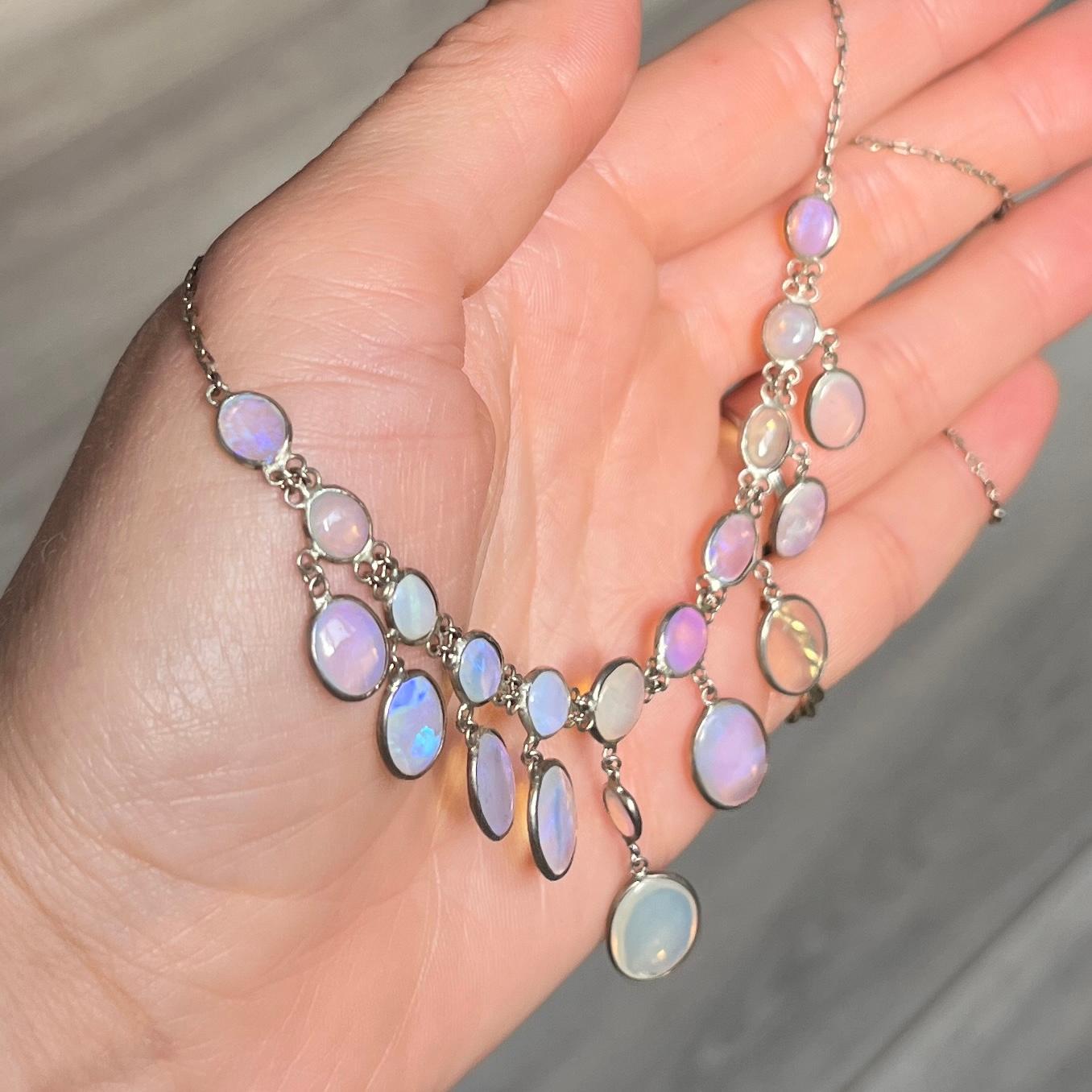 An exquisite Edwardian fringe necklace. The chain is set with oval moonstone cabochons and small drops. Modelled in silver. 

Chain Length: 42cm
Drop Length: 3.5cm

Weight: 6.9g