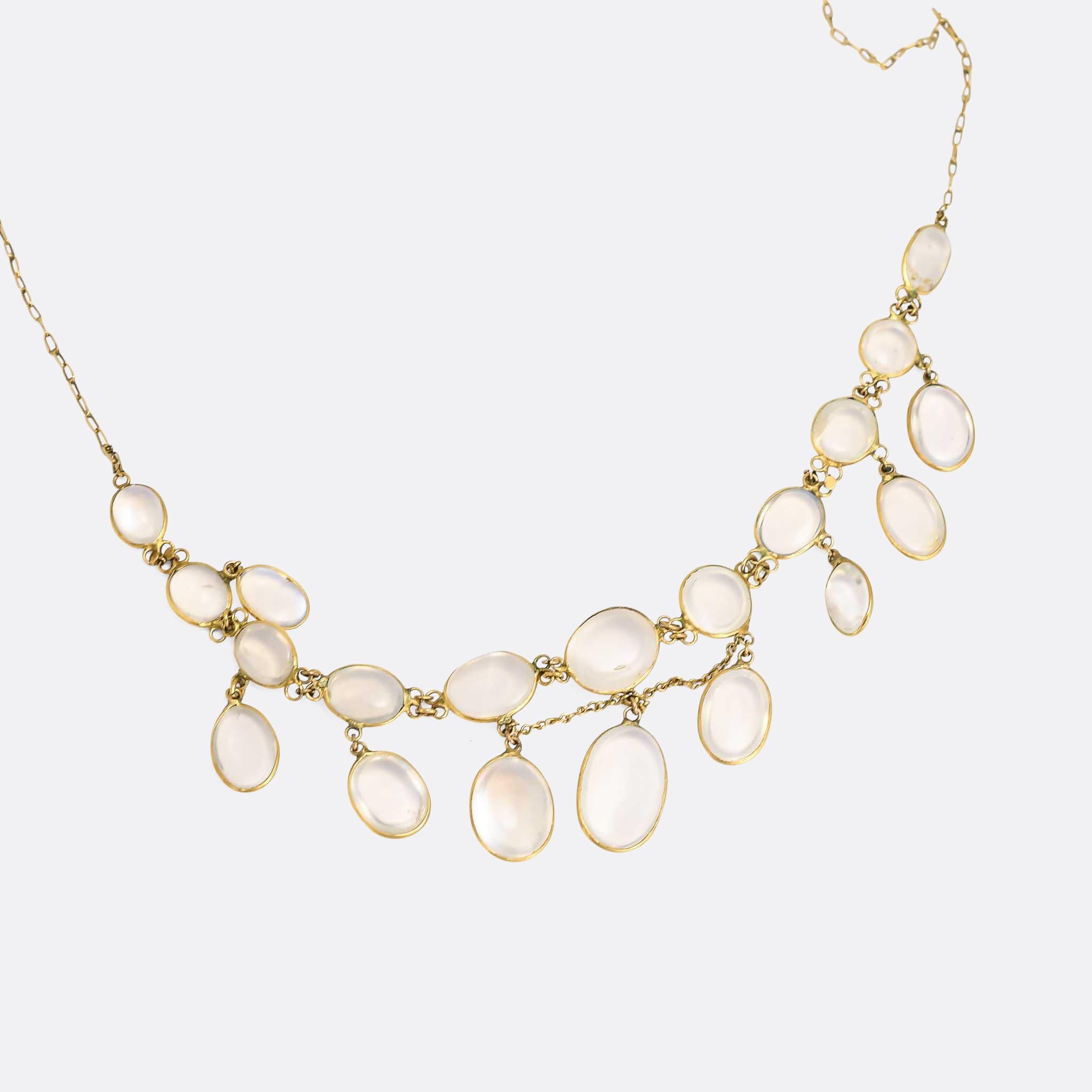 A particularly lovely antique moonstone festoon necklace dating from the Edwardian era, circa 1910. Not only is the design impeccable, but it's - somewhat unusually - crafted in 15 karat gold (they're usually 9k). It sits beautifully, and the stones