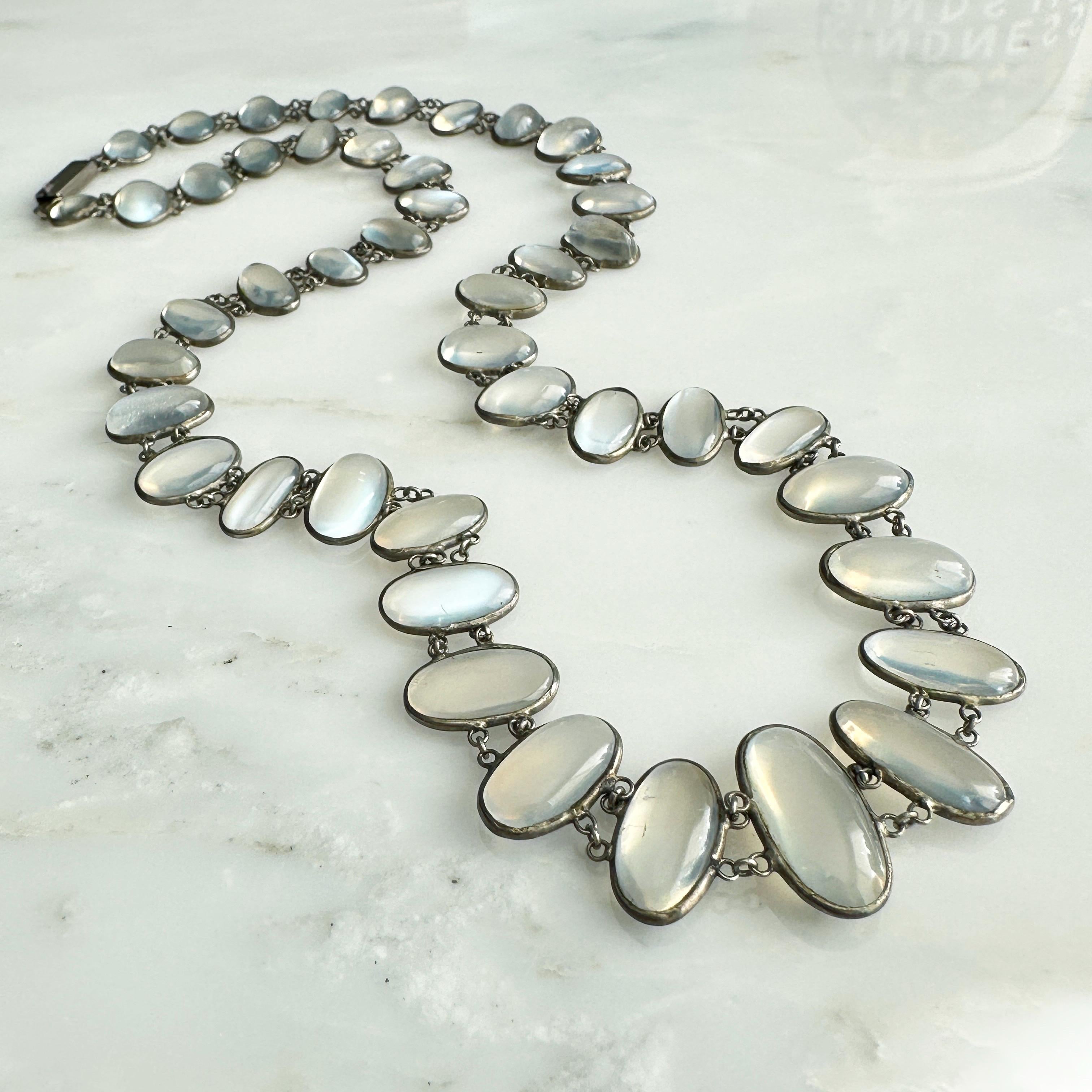Details:
Full of antique charm! Sweet Edwardian Moonstone silver necklace, that drapes beautifully over your neck and collar bone. This lovely necklace has 45 graduated natural cabochon moonstones, linked with double linked silver chain and has a