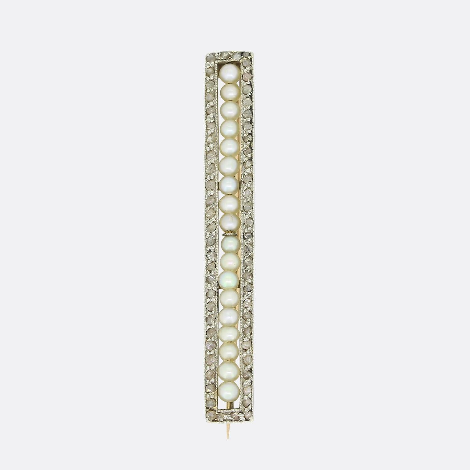 This is an 18ct gold and platinum bar brooch from the Edwardian era. The brooch is set with nineteen natural seed pearls and surrounded by a cluster of rose cut diamonds and crafted in 18ct yellow gold and platinum. 

Condition: Used (Very
