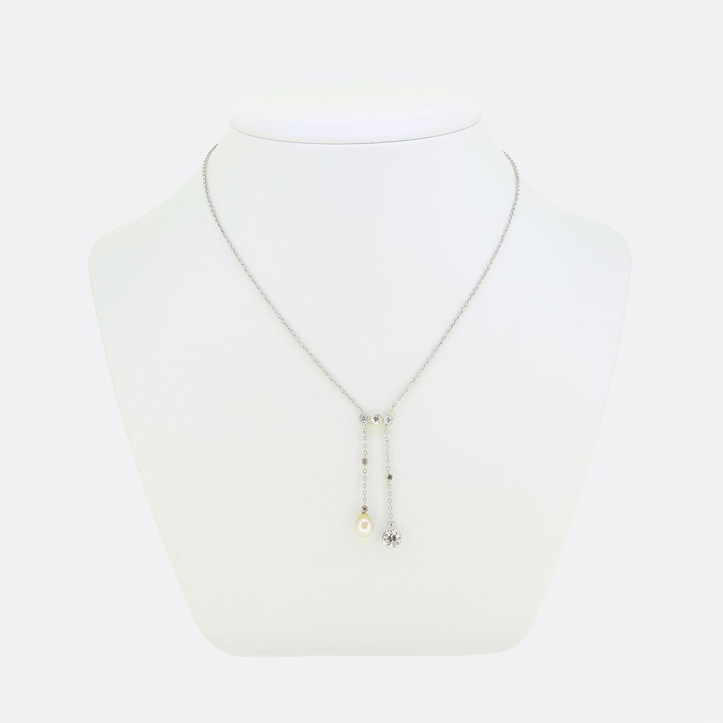 Here we have a delightful negligee necklace taken from the early stages of the 20th century. Two old cut diamond set chains elegantly descend from a trio of larger matching stones above. One chain culminates in a lustrous natural white drop pearl,