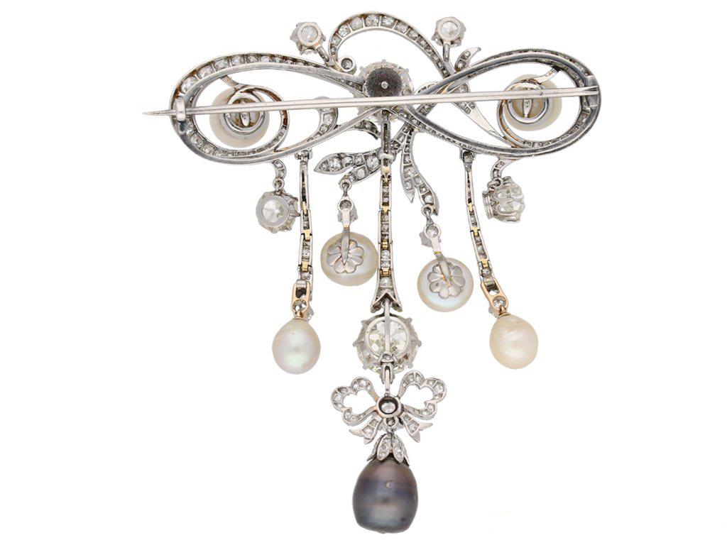 Old Mine Cut Edwardian natural pearl and diamond pendant/brooch, circa 1905.  For Sale