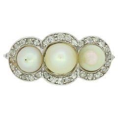Edwardian Natural Pearl Three Stone and Diamond Ring