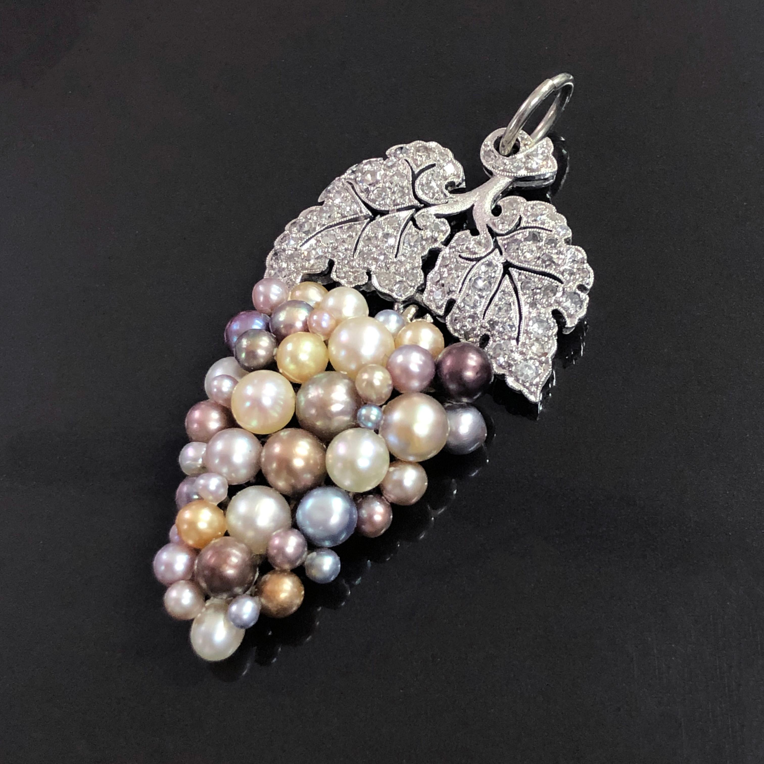 Edwardian Natural Saltwater Pearl and Diamond Vine Grapes Pendant, ca. 1910s

A beautiful and elegant pendant from the 1910s featuring a vine grapes in the form of multicoloured natural saltwater pearl boutons (certified) and milgrain set diamonds