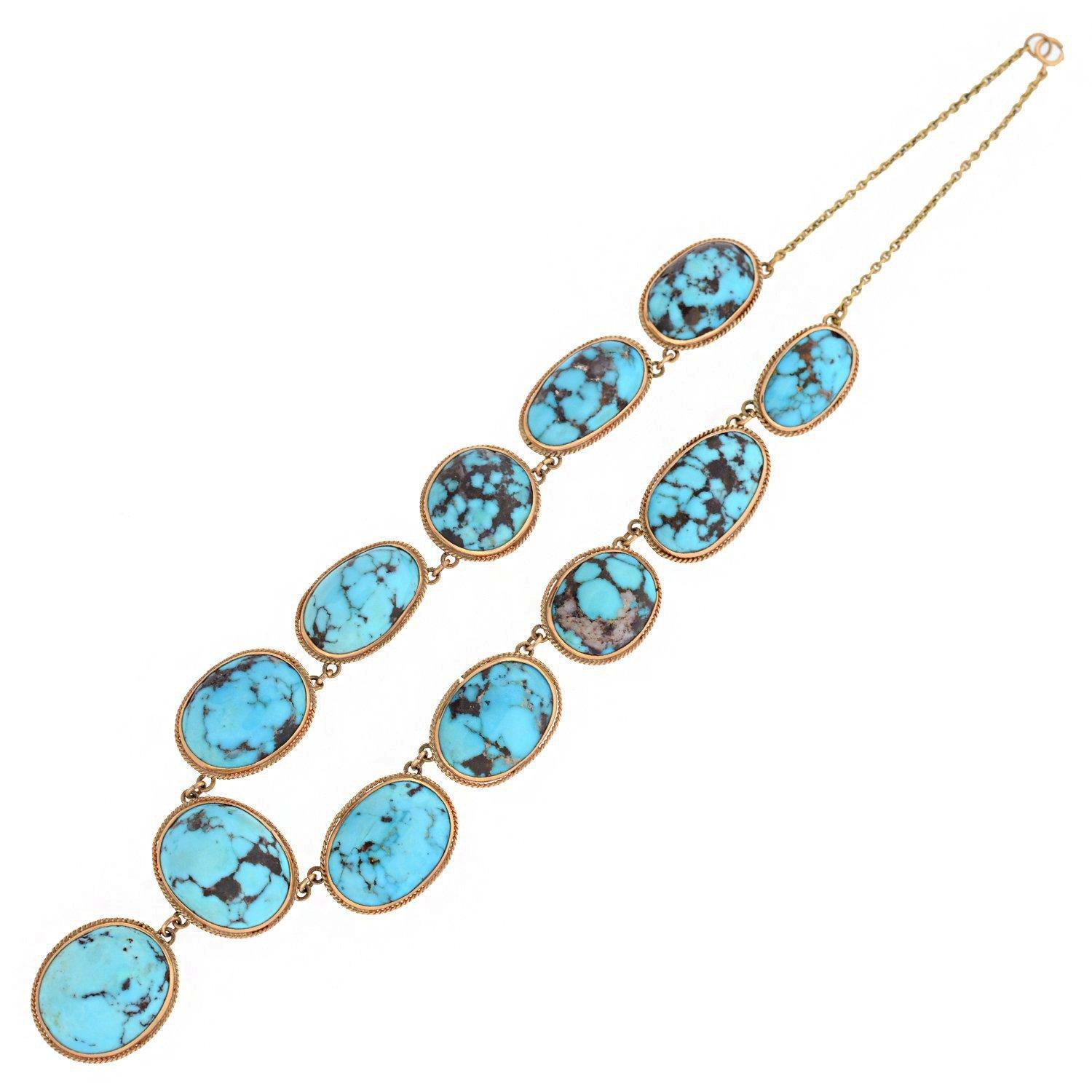 An outstanding turquoise necklace from the Edwardian (ca1910) era! This magnificent 14kt rose gold piece features twelve natural turquoise stone links that form a beautiful festoon style necklace. Dangling freely from the center is a round turquoise
