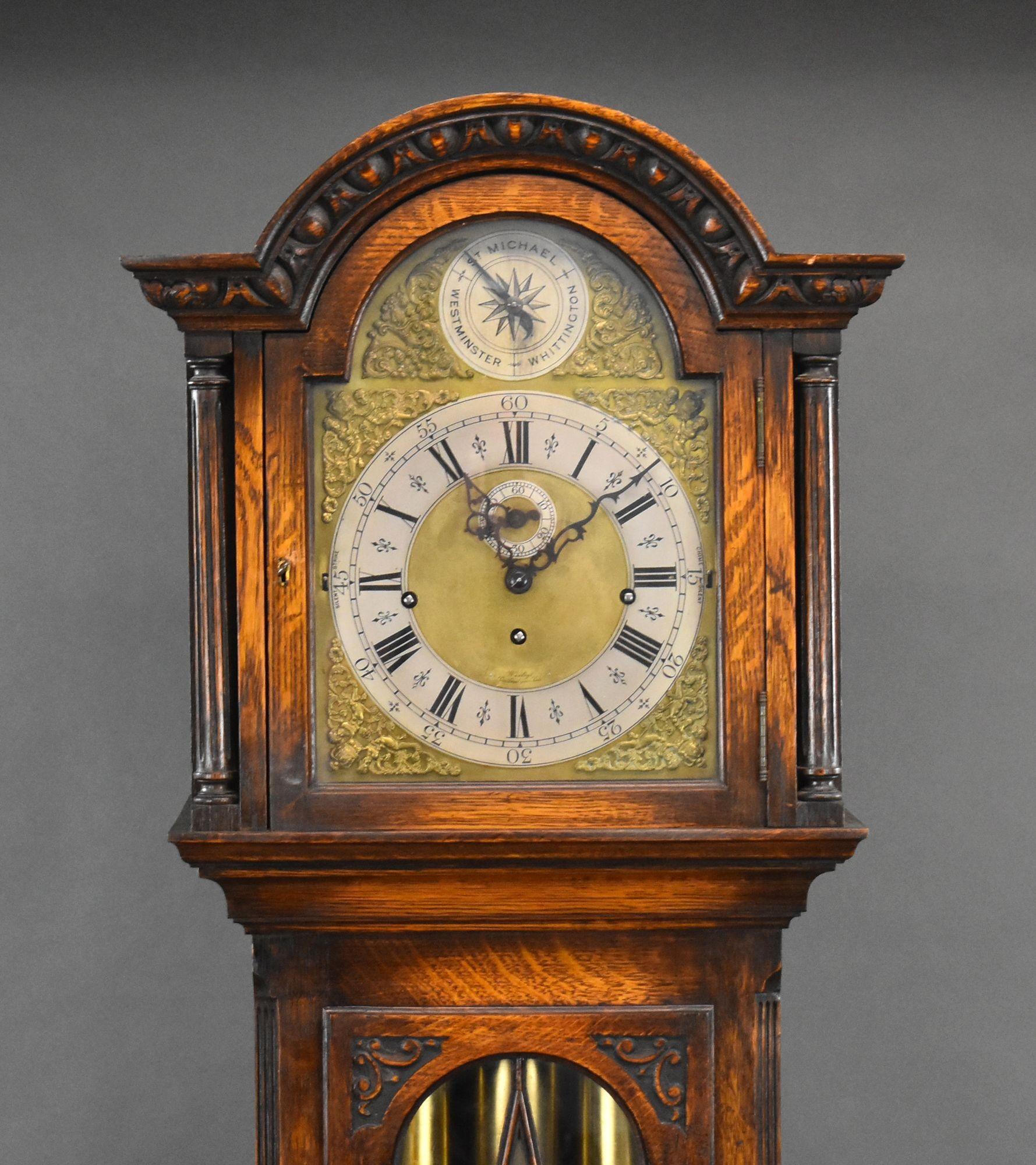 For sale is a good quality Edwardian oak 9 tube grandfather clock, having a brass dial with roman numerals and ornate hands, above a glazed door opening to reveal the pendulum and weights, above the base of the case, standing on small feet. The