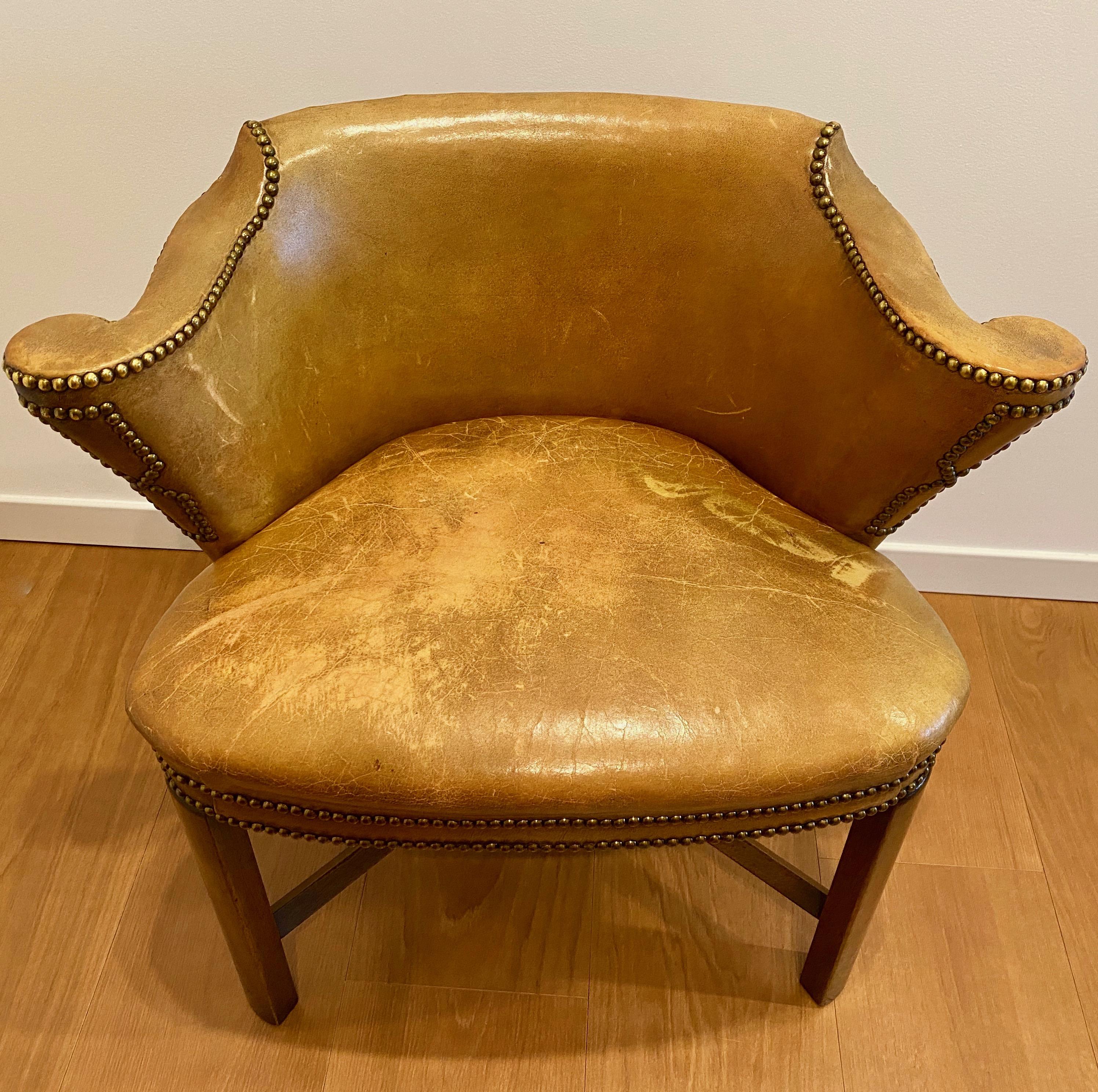 Edwardian Oak and Leather Library Armchair, Ca. 1905

This unusual shape library armchair is English of the Edwardian period (1901-1910). It reassumes the new era that the furniture and all the visual arts took with the new King; from the austere