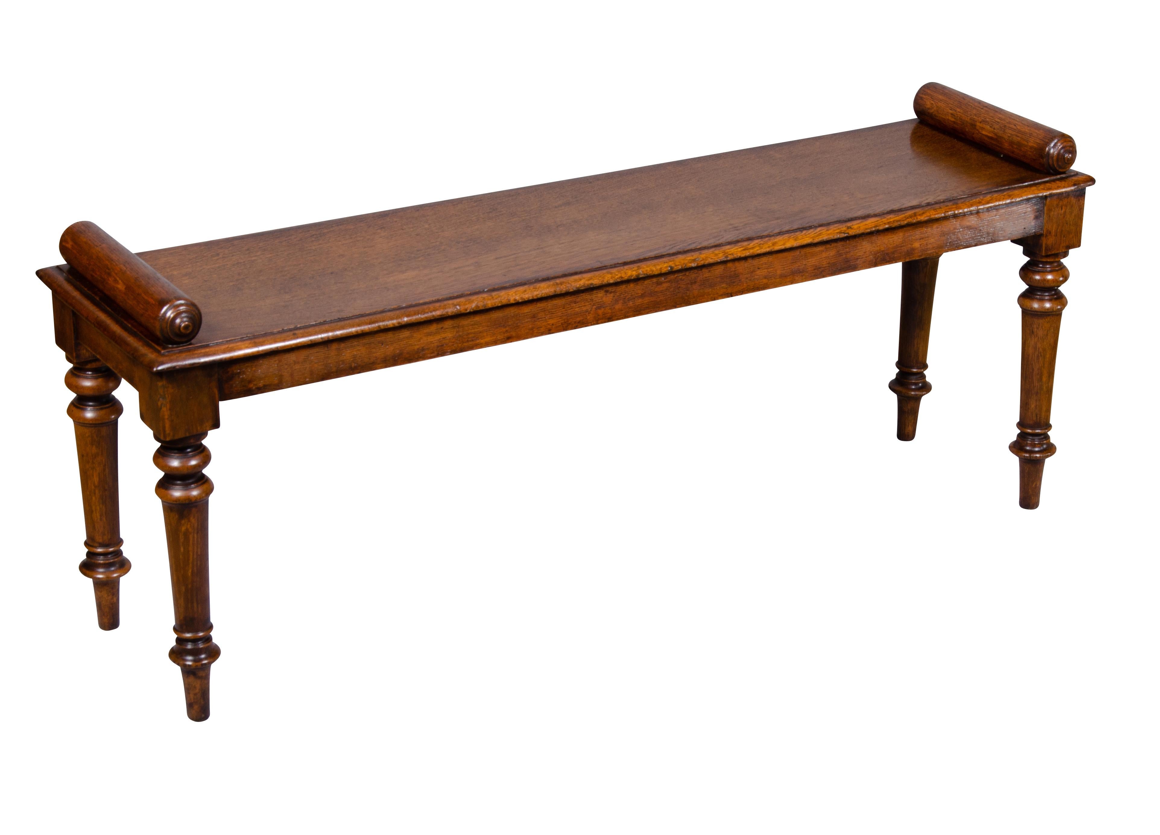 Rectangular top with cylindrical hand holds, raised on turned legs. Classic form.