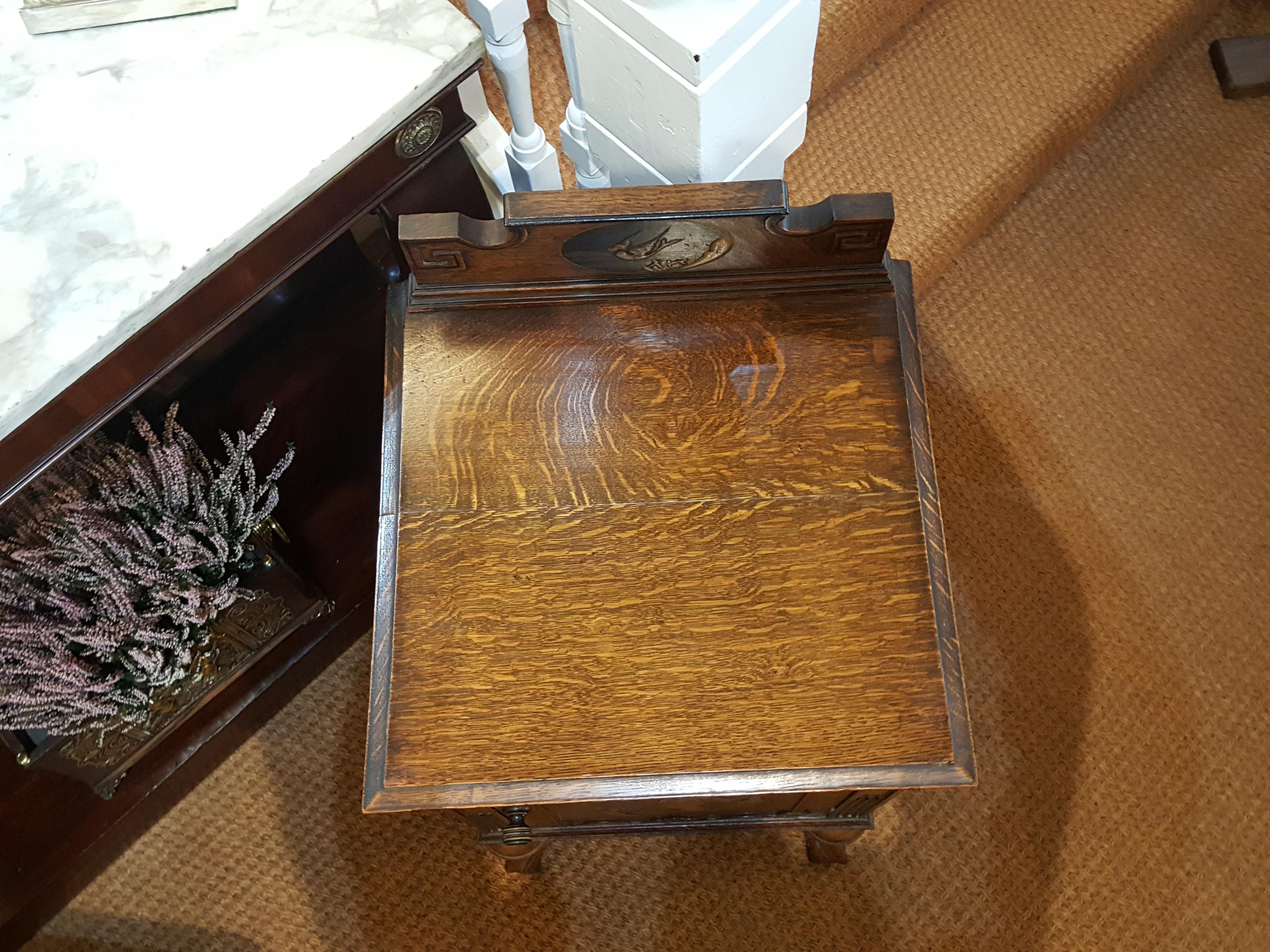 Edwardian oak shoe cabinet of jacobean form with japanned plaque can be used as a bedside table
16.5