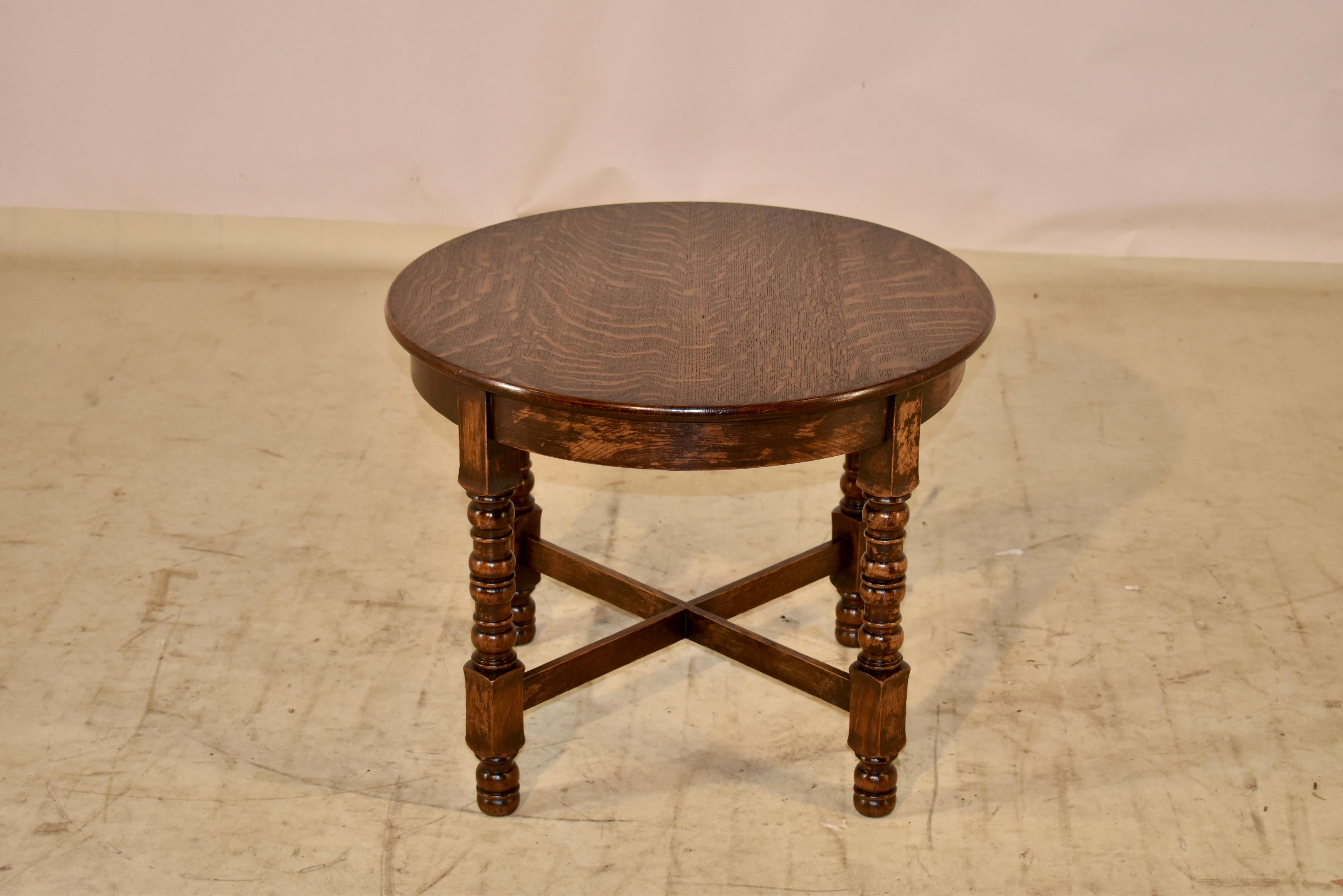 Edwardian oak side table, circa 1900. The top has lovely graining and follows down to a simple apron. The table is supported on hand turned legs, which are joined by simple cross stretchers. This is a wonderful little occasional table that could be