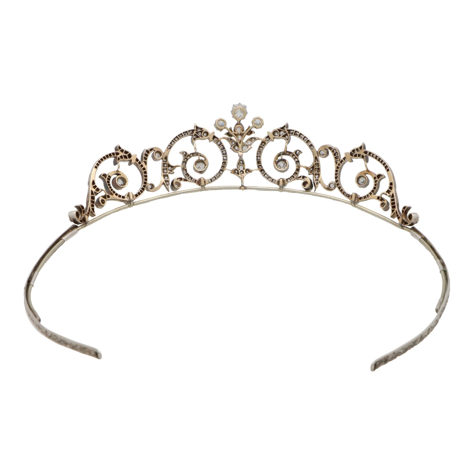  A truly elegant Edwardian old cut diamond tiara set in silver and gold, circa 1910.

This beautifully handcrafted tiara is composed of a number of elegant foliate scroll motifs, commonly seen within the Victorian and Edwardian jewellery eras. The