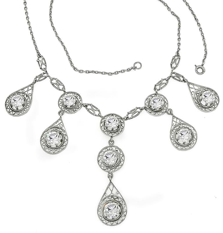 This fabulous platinum necklace from the Edwardian era, is set with sparkling old mine cut diamonds that weigh 5.09ct. graded G-H color with VS1-VS2 clarity. The necklace measures 15 inches in length and weighs 12.4 grams.


Inventory #61899RORS