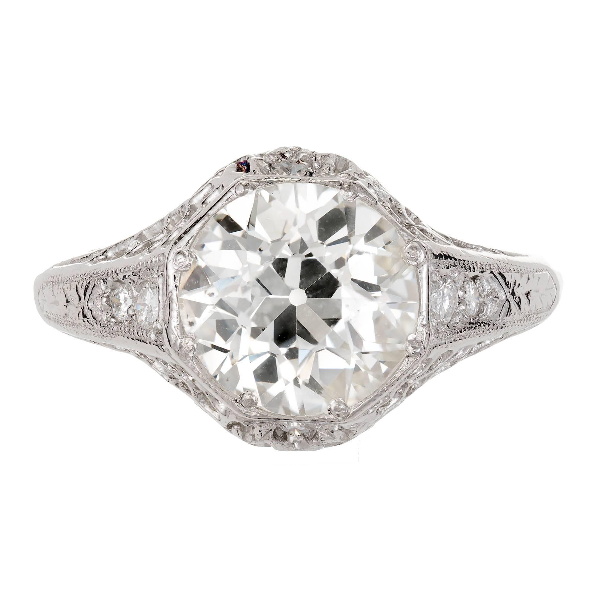 All original Edwardian Art Deco 1910 to 1920 Platinum filigree engagement ring with original old European cut diamond, K color and SI1 clarity, super bright and sparkly. Faces up with a slightly warm bright appearance.

1 old European cut diamond,