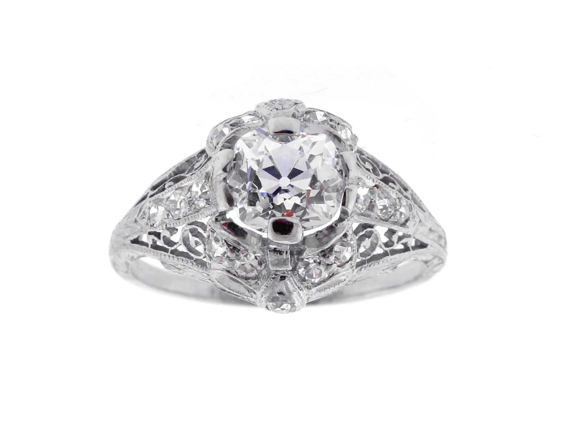 From Edwardian period and antique diamond engagement ring featuring a 1.14 carat Old mine cut diamond
♦ Metal: Platinum
♦ Old Mine cut diamond=1.14 carats  J color, VS1 clarity GIA report
♦ 16 Diamonds=.35
♦ Circa 1920s
♦ Size 6, Resizable
♦