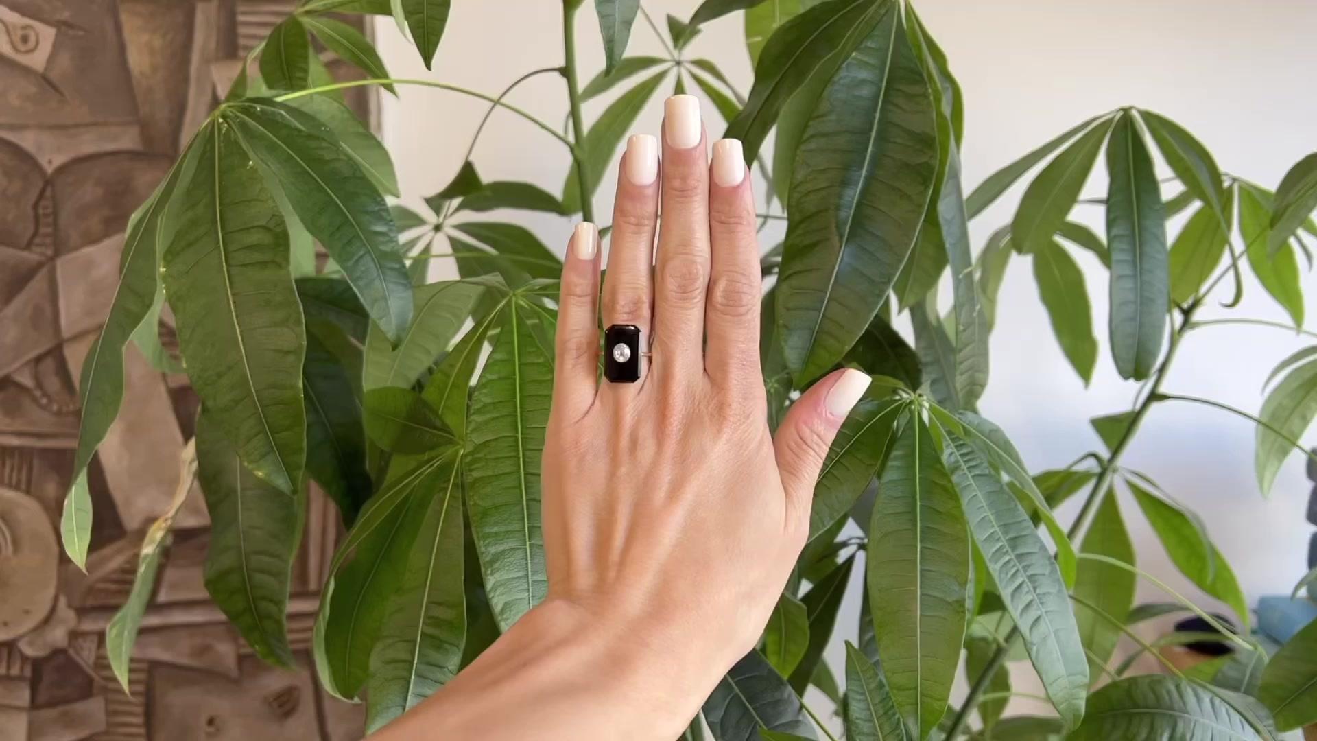 One Edwardian Old Mine Cut Diamond Onyx 14 Karat Rose Gold Ring. Featuring one old mine cut diamond weighing approximately 0.65 carat, graded I color, I1 clarity. Accented by one piece of onyx. Crafted in 14 karat rose gold. Circa 1900. The ring is