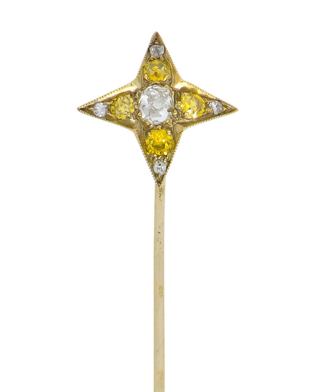 Star shaped platinum mount centering an old mine cut diamond weighing approximately 0.23 carat, I color and I clarity

Surrounded by four, sunny yellow old European cut diamonds weighing approximately 0.24 carat total, SI to I clarity

Accented by