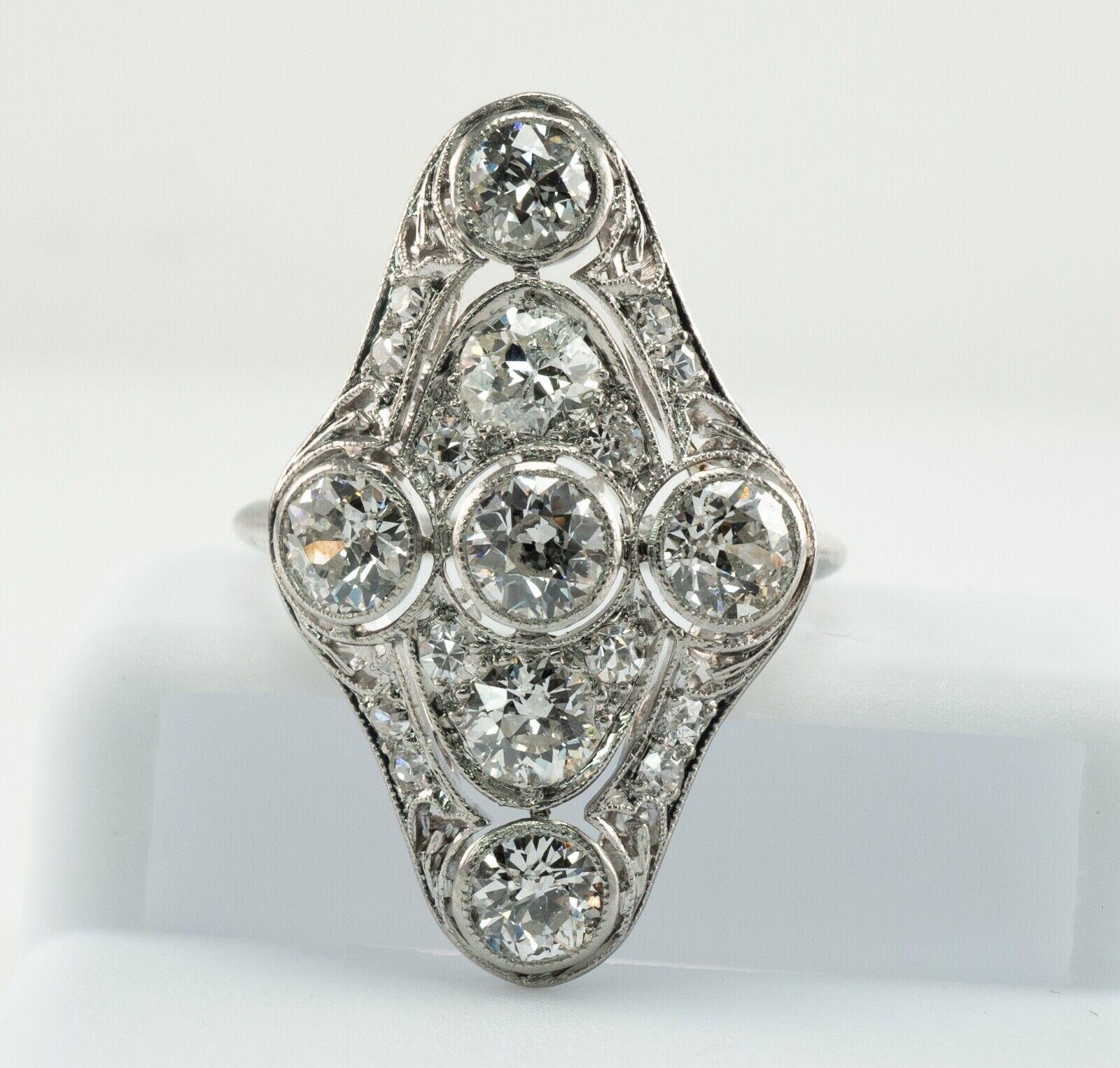 This gorgeous antique from Edwardian era ring is finely crafted in solid Platinum.
The ring is carefully tested and guaranteed. 
The ring is set with 19 natural old mine diamonds totaling 2.06 carats (.03ct - to .30 cts). 
All diamonds are original
