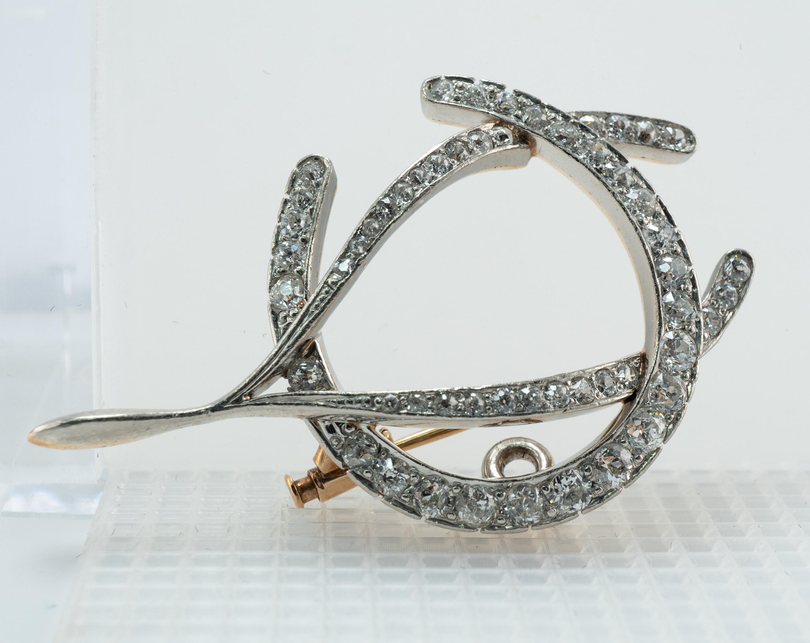 Edwardian Old Mine Diamond Wishbone Brooch Pin Pendant 14K Gold

This gorgeous Edwardian circa 1890-1910s Brooch Pin is crafted in Platinum for the top, and 14K Yellow gold for the pin and clasp.
The metal has been tested by applying nitric