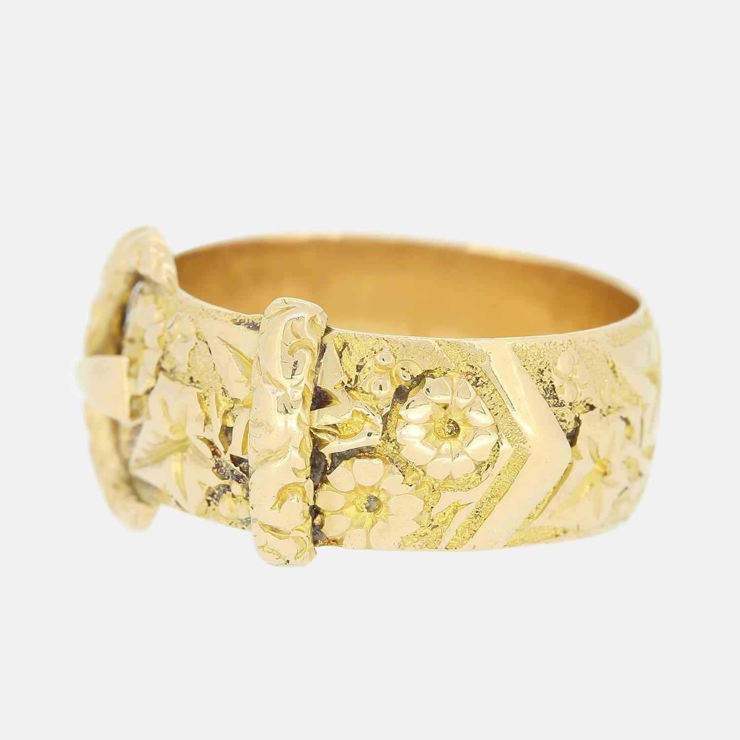 This is an 18ct yellow gold Edwardian buckle ring. The buckle features an ornate handcrafted floral pattern. The buckle motif never seems to go out of style. Popular in the 1800s and still sought after today. The tone of this ring is somewhere