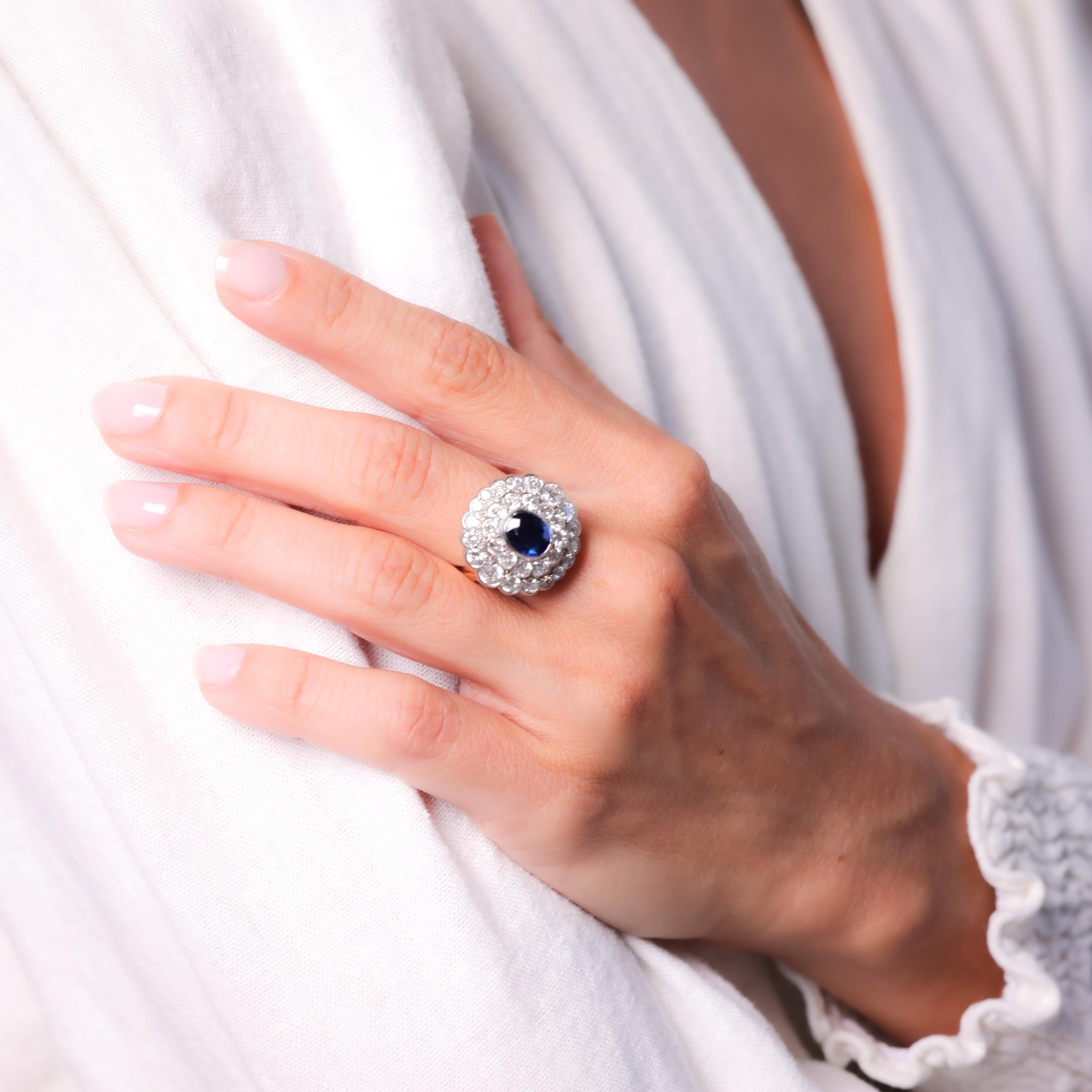 Center Stone: Oval Cut Blue Sapphire 
Weight: Approximately 1.4 Carat
Accent Stone: 30 Old European, Single and Round Brilliant Cut Diamonds
Weight: Approximately 2.2 Carats
Color: H-I
Clarity: VS2
Metal: 14K Yellow Gold and Platinum 
Era: Edwardian