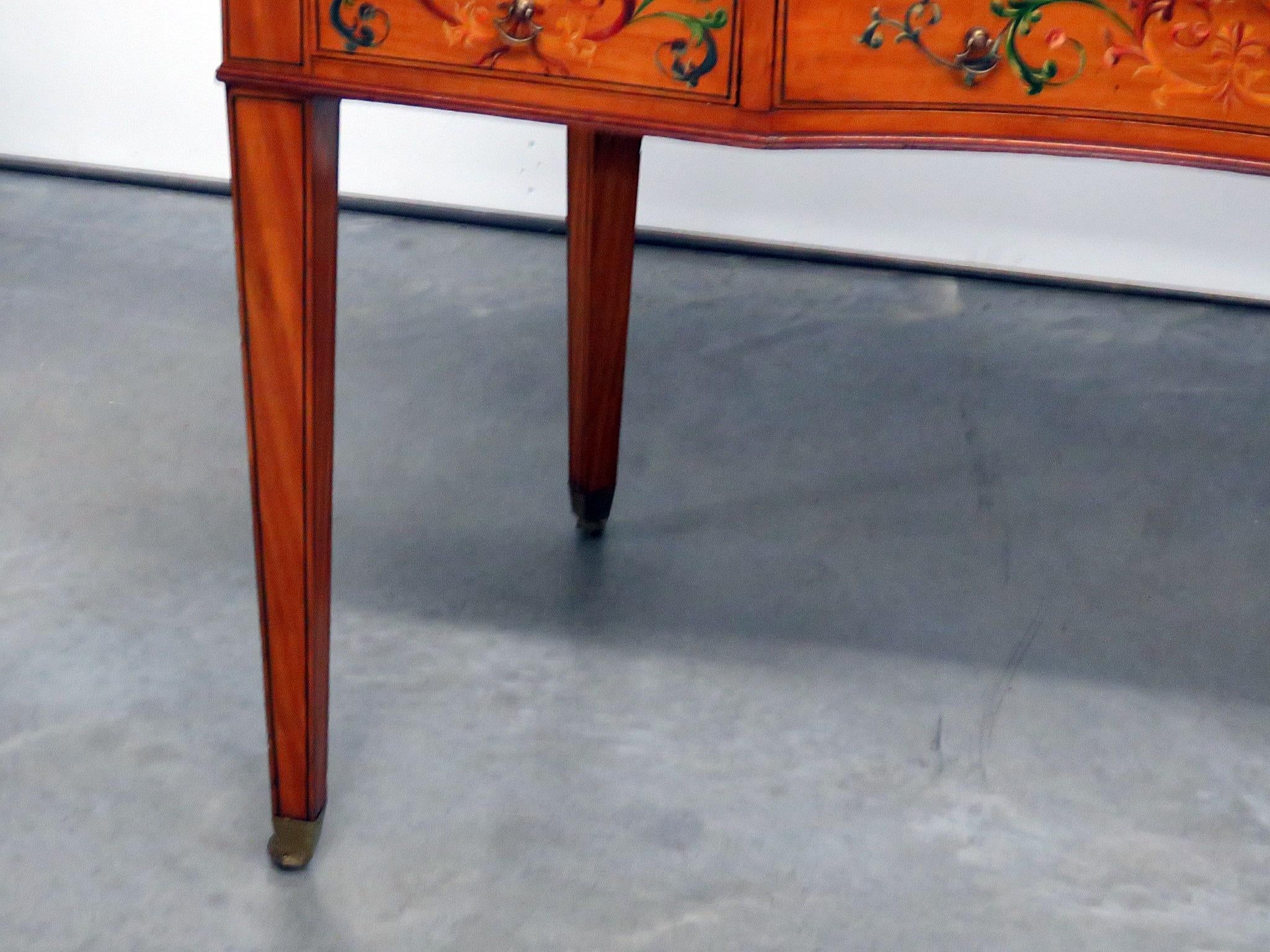 Edwardian 7-drawer paint decorated leather top desk with a brass gallery.