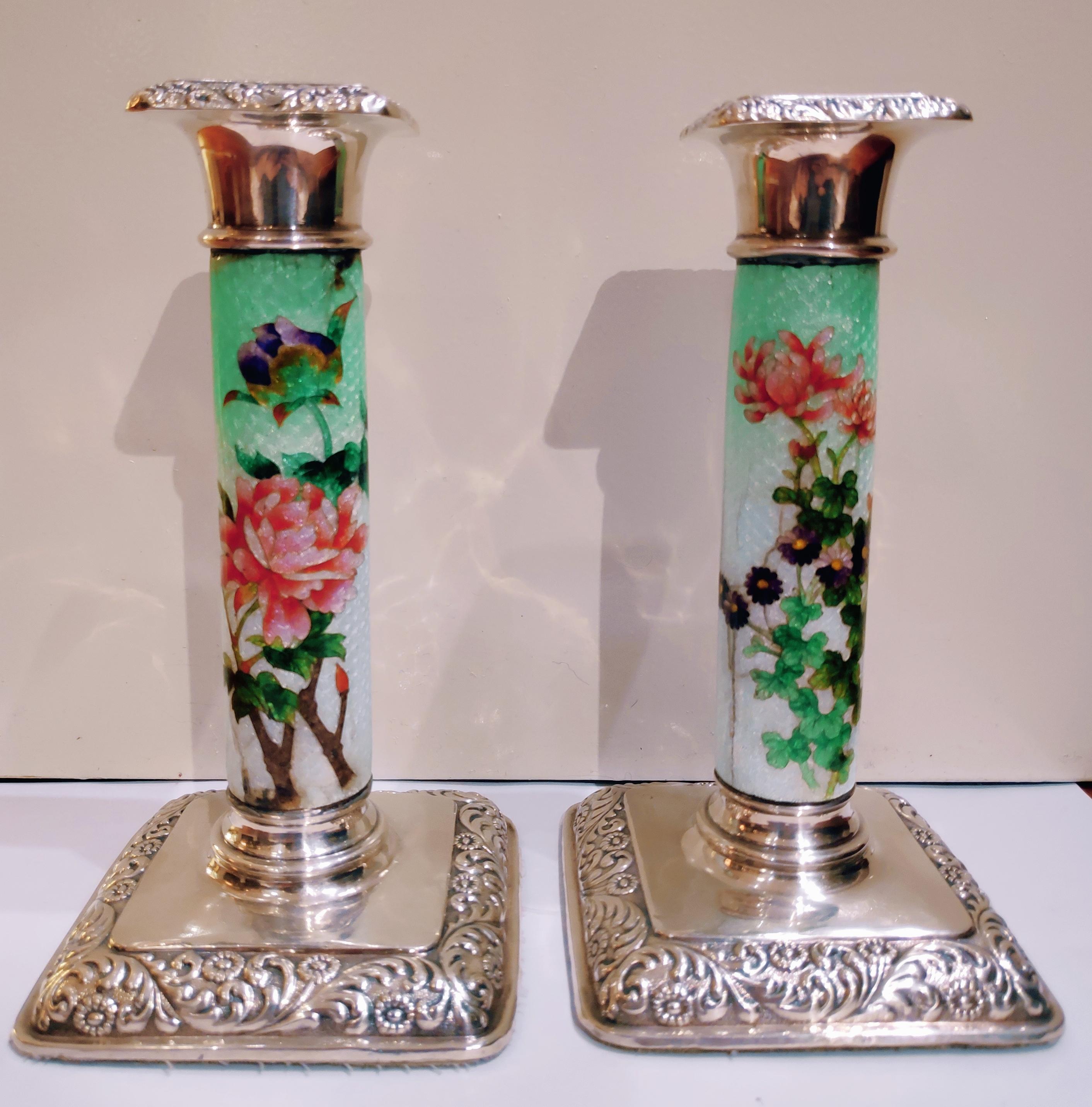 English sterling candlestick with square silver base, enamel shaft with foil cloisonné morning glory decoration, and sterling bobeche. Marks Birmingham, 1906.