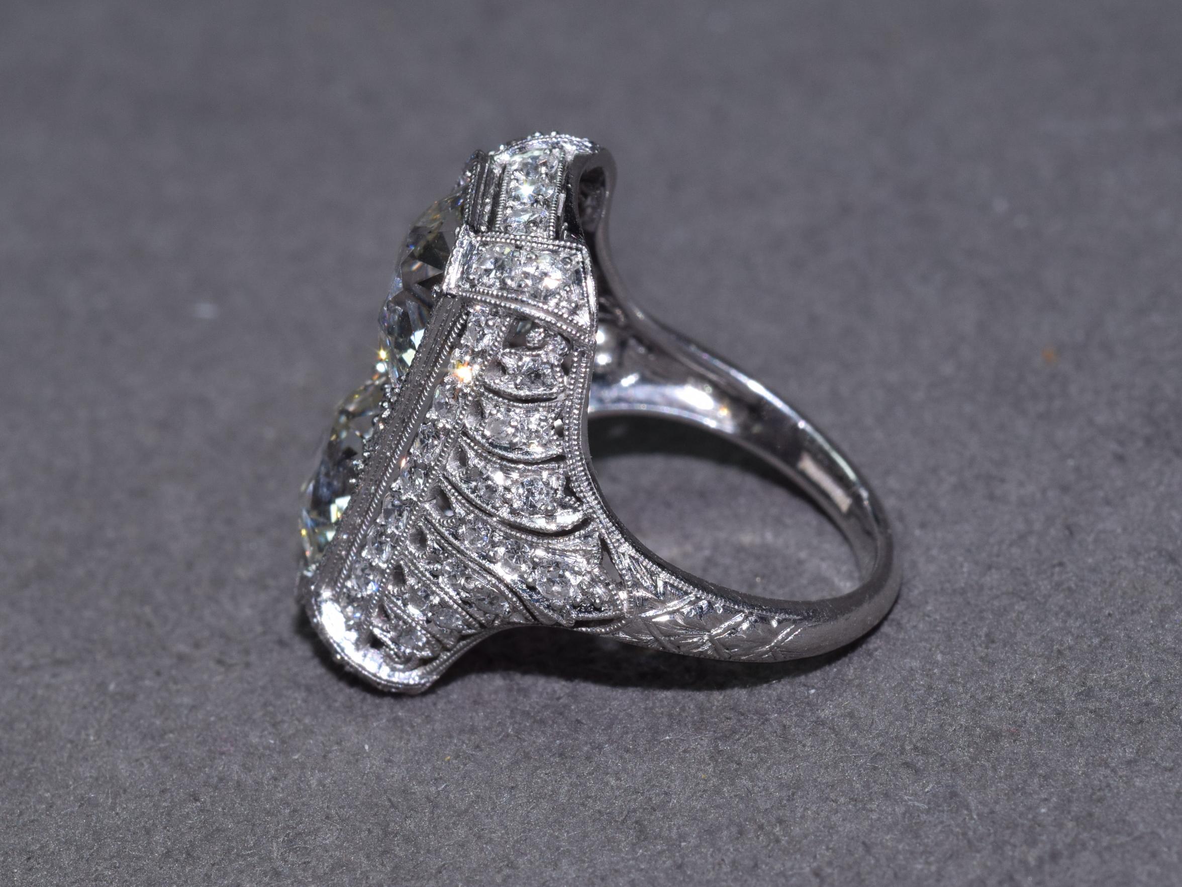 Edwardian Peacock Old European Cut Diamond Twin Stone Ring In Good Condition In New York, NY