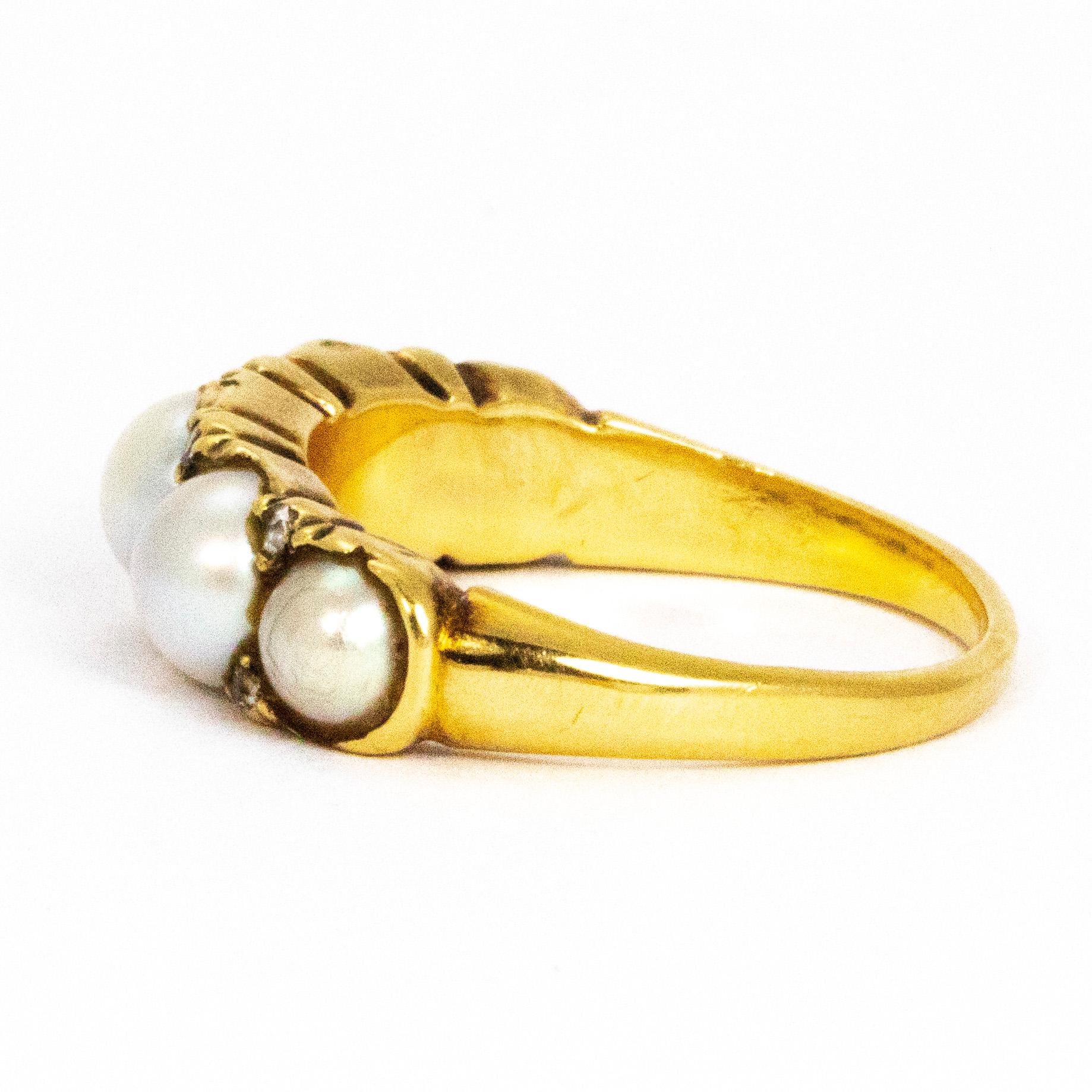 The pearls in this five stone ring have a stunning sheen to them and to add that little sparkle there are eight rose cut Diamond points in between the stones. The size of the stones give the ring a chunky feel and are graduated in size starting with