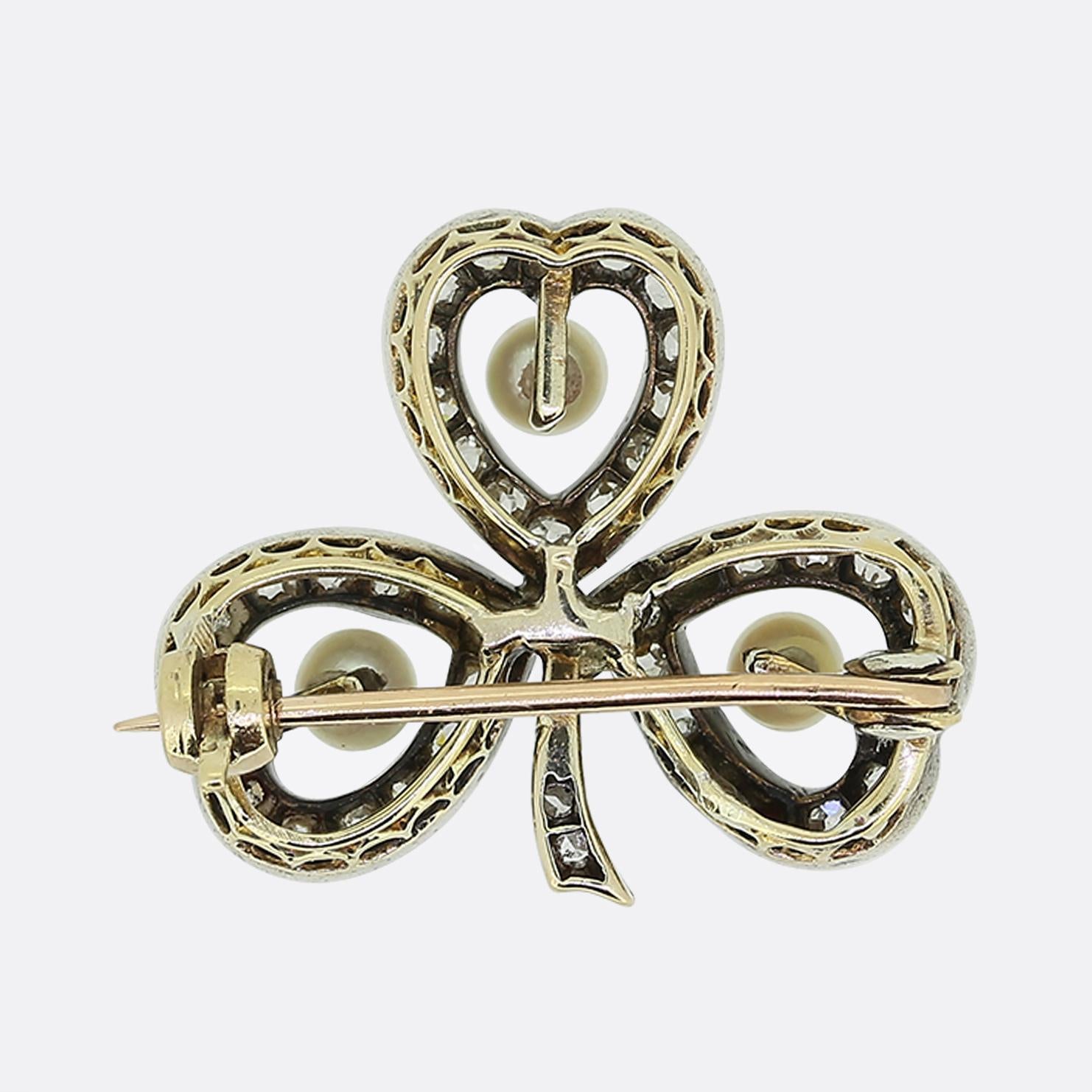 Here we have a gorgeous brooch originally dating back to the Edwardian period. This piece has been crafted from yellow gold into the shape of a three-leaf clover. Each individual leaf showcases a single round shaped natural pearl which has been