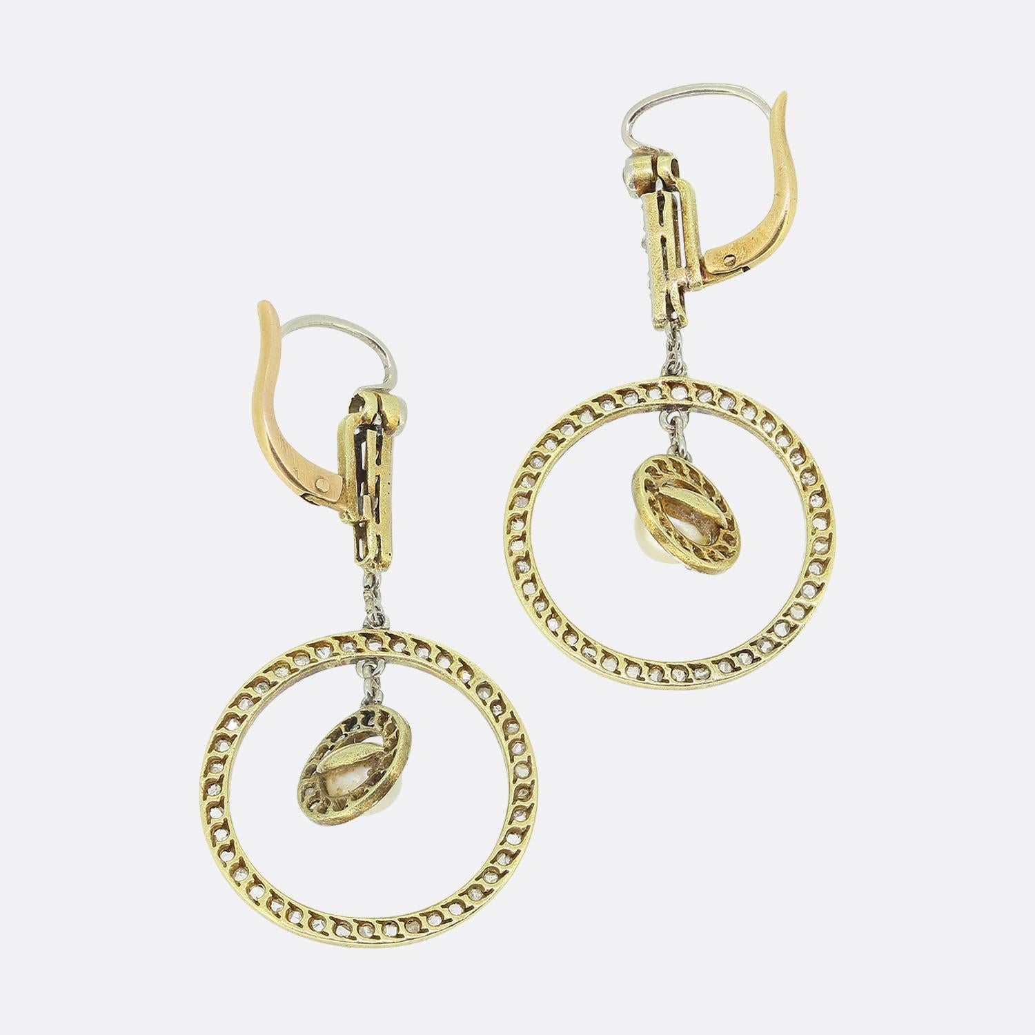 Here we have an excellent pair of drop earrings from the turn of the 20th century. Each piece has been crafted from 18ct yellow gold and showcases five rose cut diamonds which have been platinum set in a vertical fashion; designed to suspend a