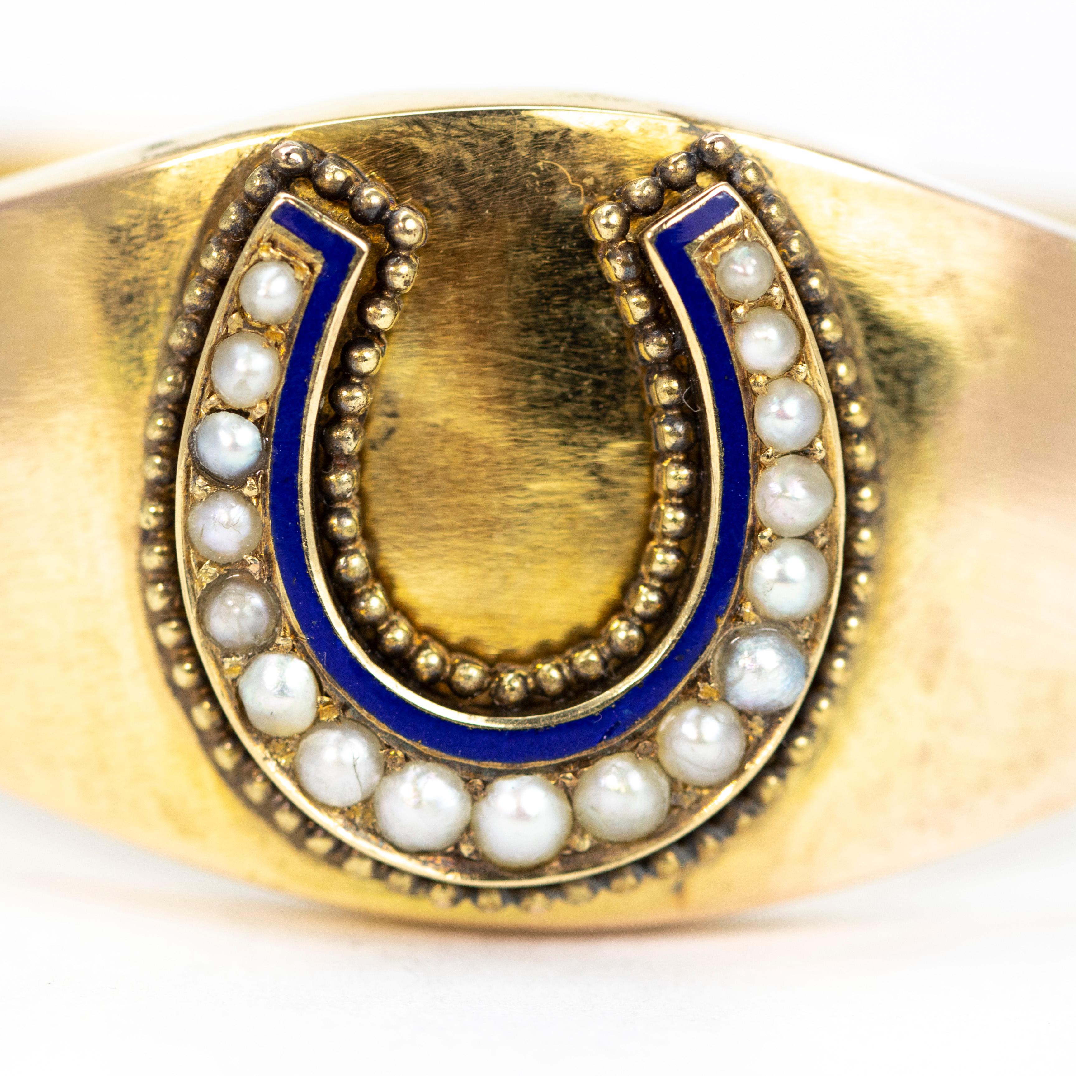 This could be your lucky bangle! The horseshoe is surrounded by beaded gold which is then followed by blue enamel and the main detail are the graduated split pearls. 

Inner Diameter: 5.6cm 
Widest Point: 22mm

Weight: 21g