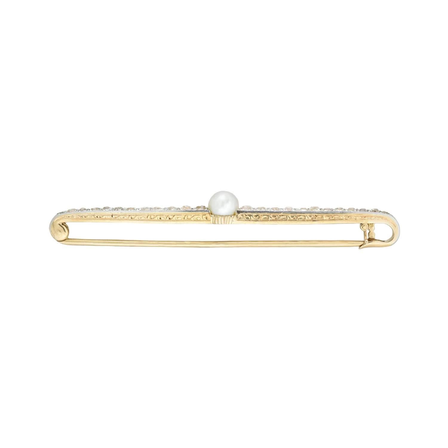 A beautiful pearl and diamond bar pin from the Edwardian (ca1910) era! Crafted in 18kt yellow gold and topped in platinum, this piece features 24 Old Mine Cut diamonds and a single white pearl. The diamonds graduate towards the center of the pin and