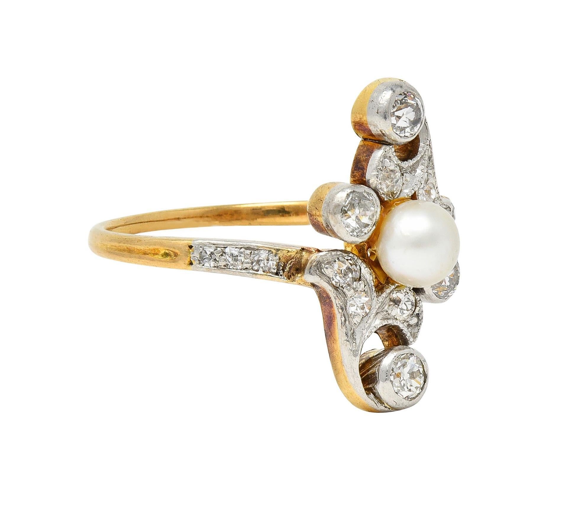 Designed as a bypass style navette form with pierced platinum-topped ginkgo leaf motif 
Centering a 4.3 mm round pearl - white with moderate iridescence
Bead and bezel set throughout with old European cut diamonds 
Weighing approximately 0.44 carat