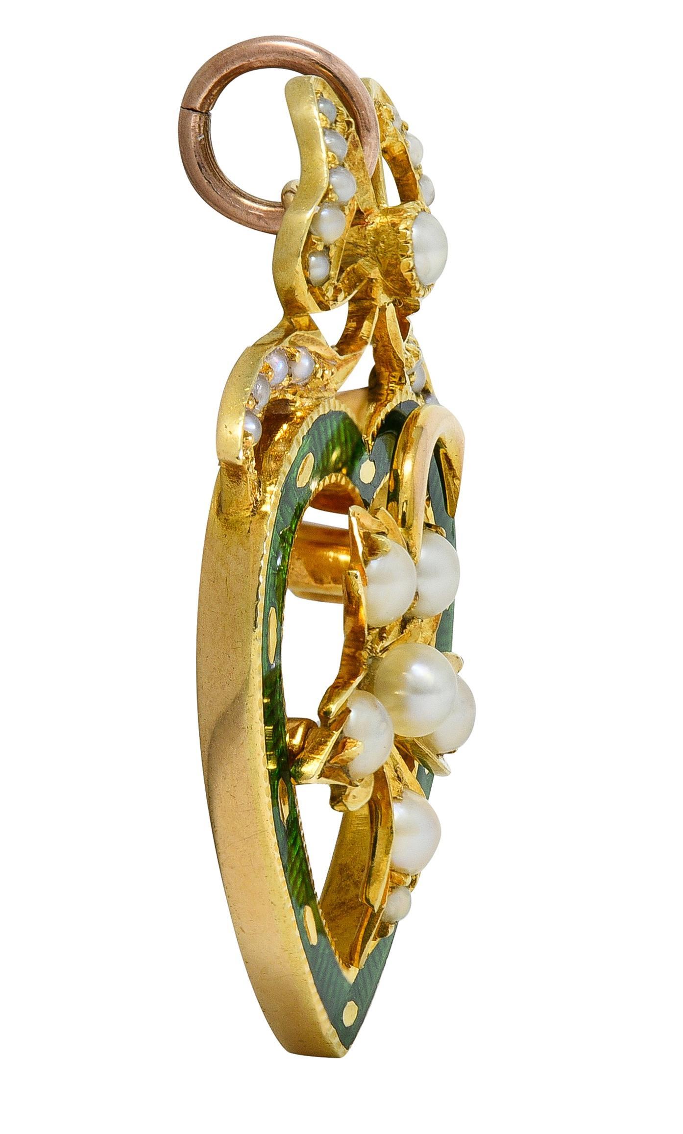 Edwardian Pearl Enamel 14 Karat Yellow Gold Antique Bow Heart Pendant In Excellent Condition For Sale In Philadelphia, PA