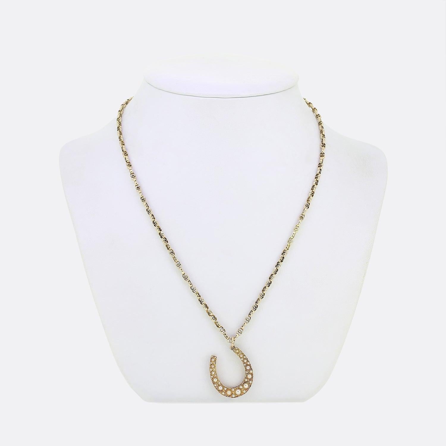 Here we have a charming necklace dating back to the Edwardian period. The pendant has been crafted from 15ct yellow gold into the shape of a lucky horseshoe and set with a vast array of round natural seed pearls which collectively graduate in size