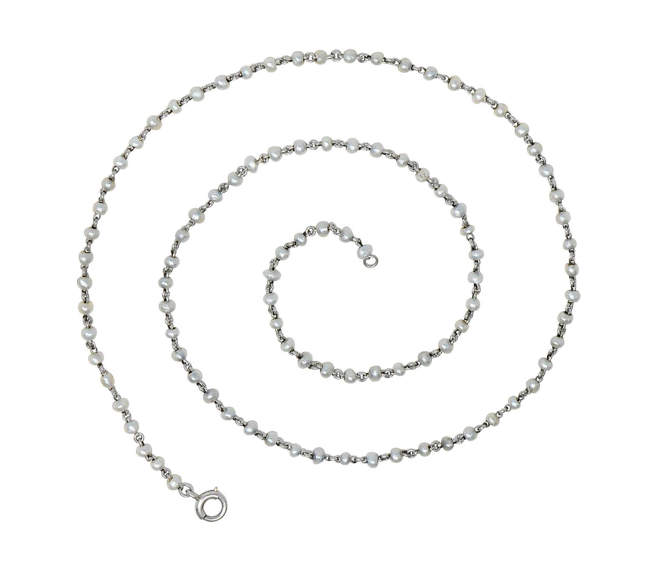 Comprised of platinum links with 2.0 to 2.5 mm near-round seed pearl beads
Cream to gray in body color with strong iridescence 
Connected via jump ring links 
Completed by spring clasp closure 
Tested as platinum
Circa: 1910
Width at widest: 1/8