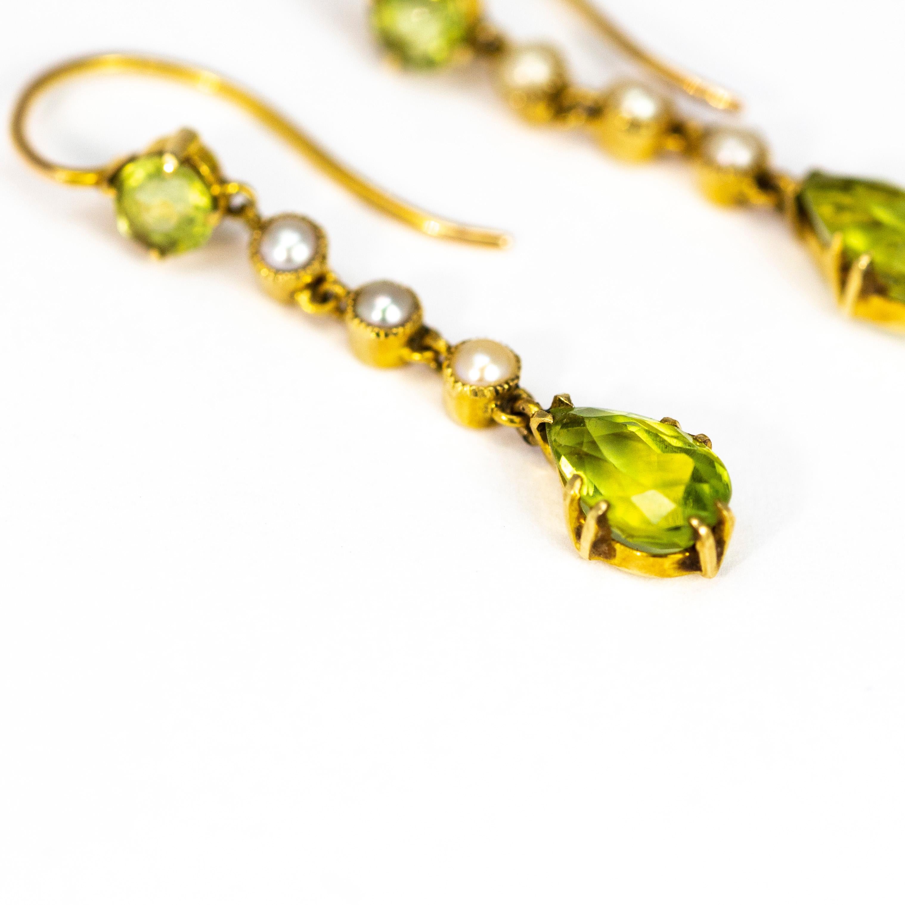 The pop of the green peridot next to the gorgeous 15ct gold is beautiful. At the bottom of the drop is a tear drop stone and above this are three delicate pearls and to finish off there is a bright green round peridot.

Drop Length: 33mm 
Tear Drop