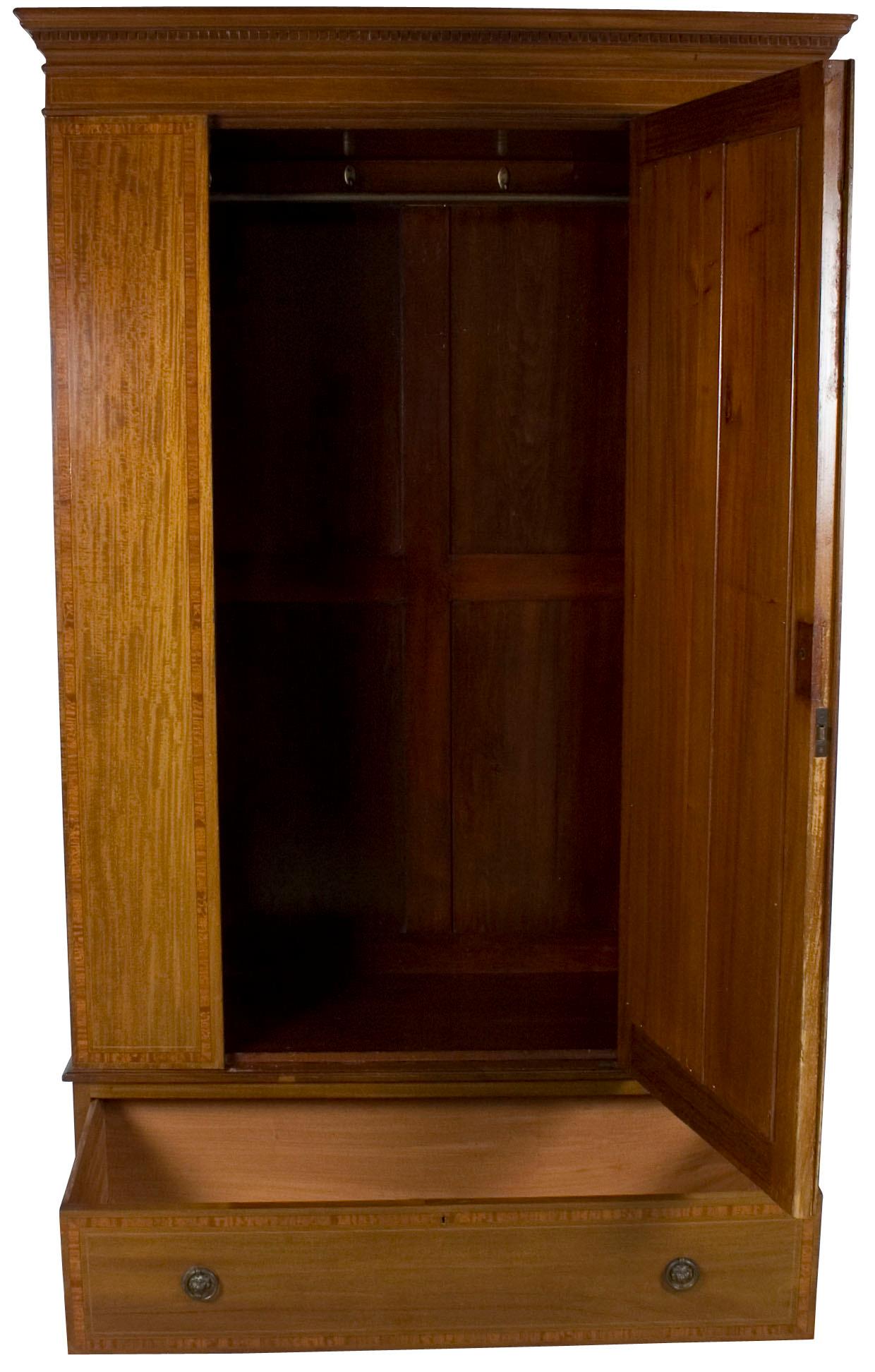 Made in England during the Edwardian period (circa 1910), this gorgeous antique wardrobe provides storage for a variety of needs.
Featuring a mirrored door with rectangular panels, this mahogany wardrobe compliments any decor. Inside is a large