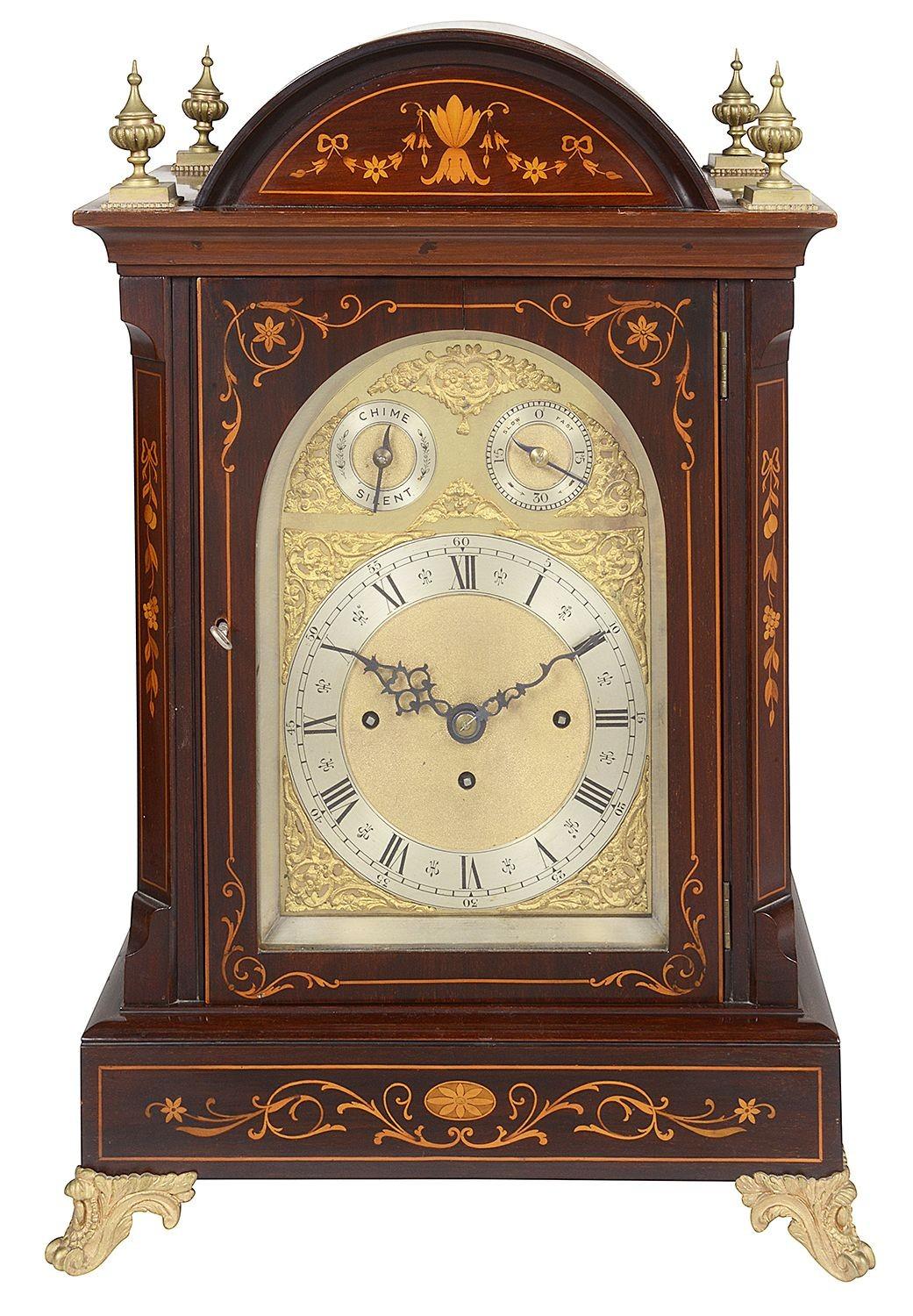 A very good quality Edwardian period Mahogany musical bracket clock, with boxwood inlaid decoration, ormolu finials and feet. The brass arch dial clock face, with a strick silent option. ~Striking hourly and half hourly on gongs.

Batch 69 61366.