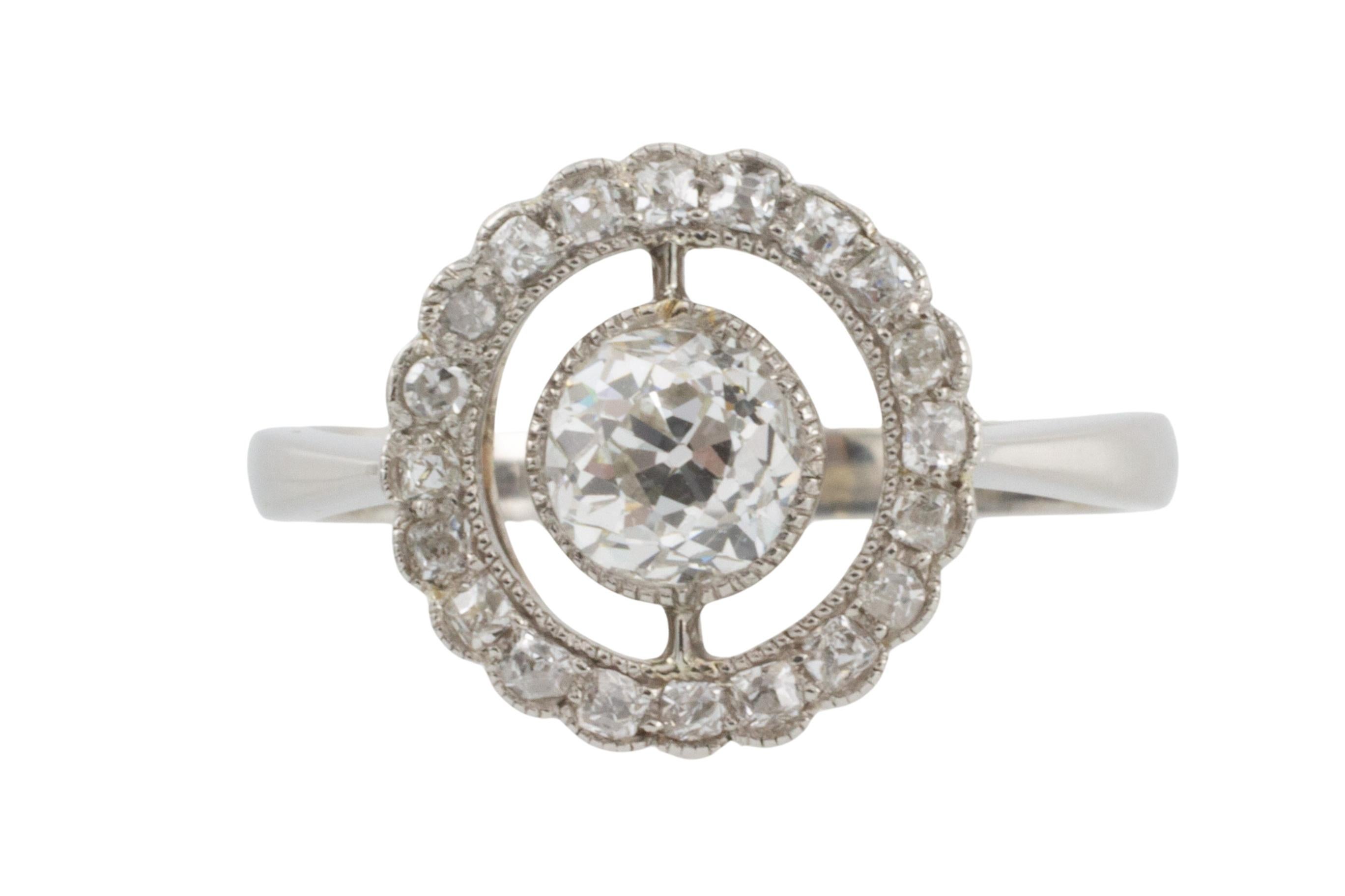 Women's Edwardian period platinum target ring with old cut diamonds For Sale