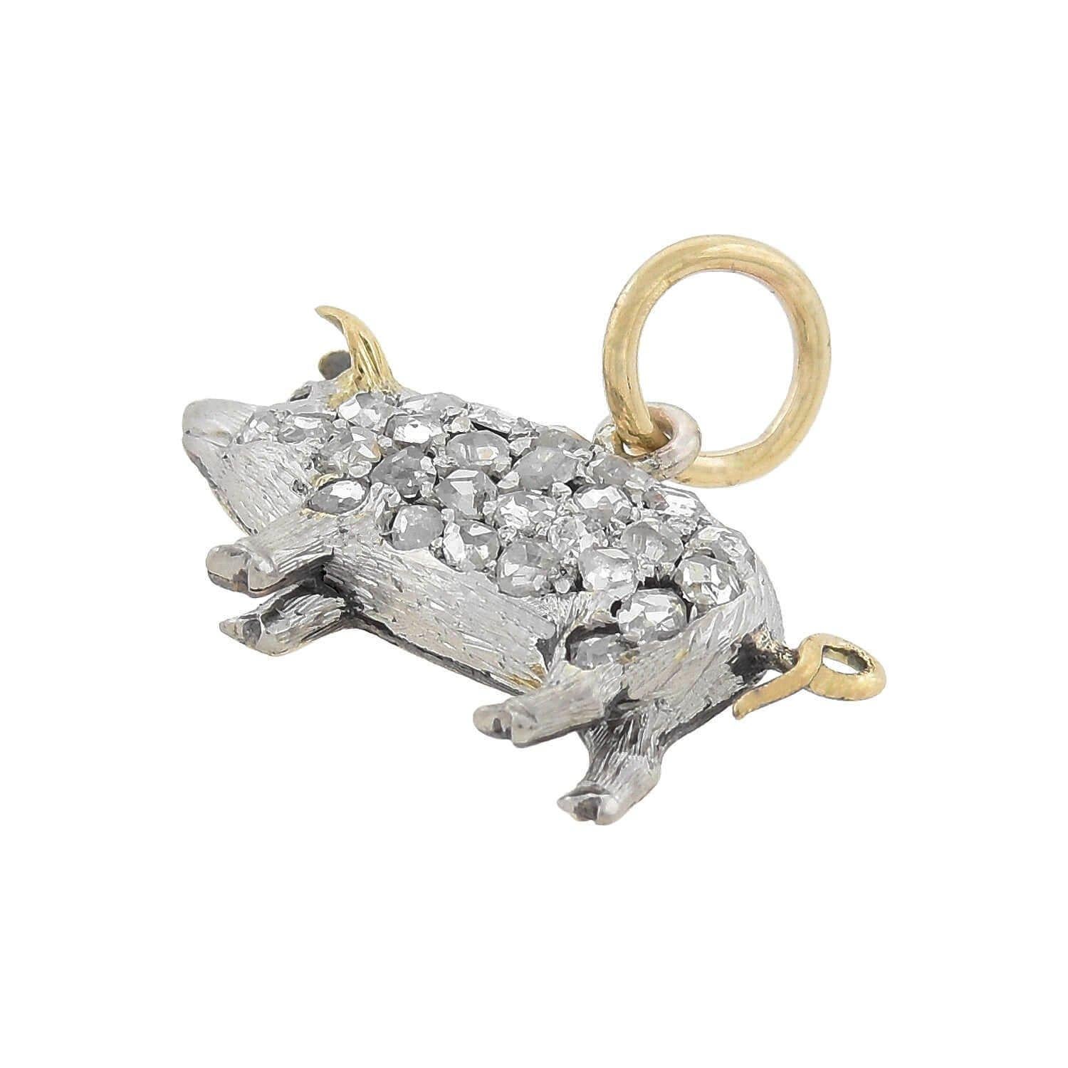 An absolutely lovely diamond pig charm pendant from the Edwardian (ca1910s) era! This wonderful piece is crafted of platinum-topped 15kt yellow gold and portrays a petite potbelly pig, whose body is encrusted with sparkling old Rose Cut diamonds.