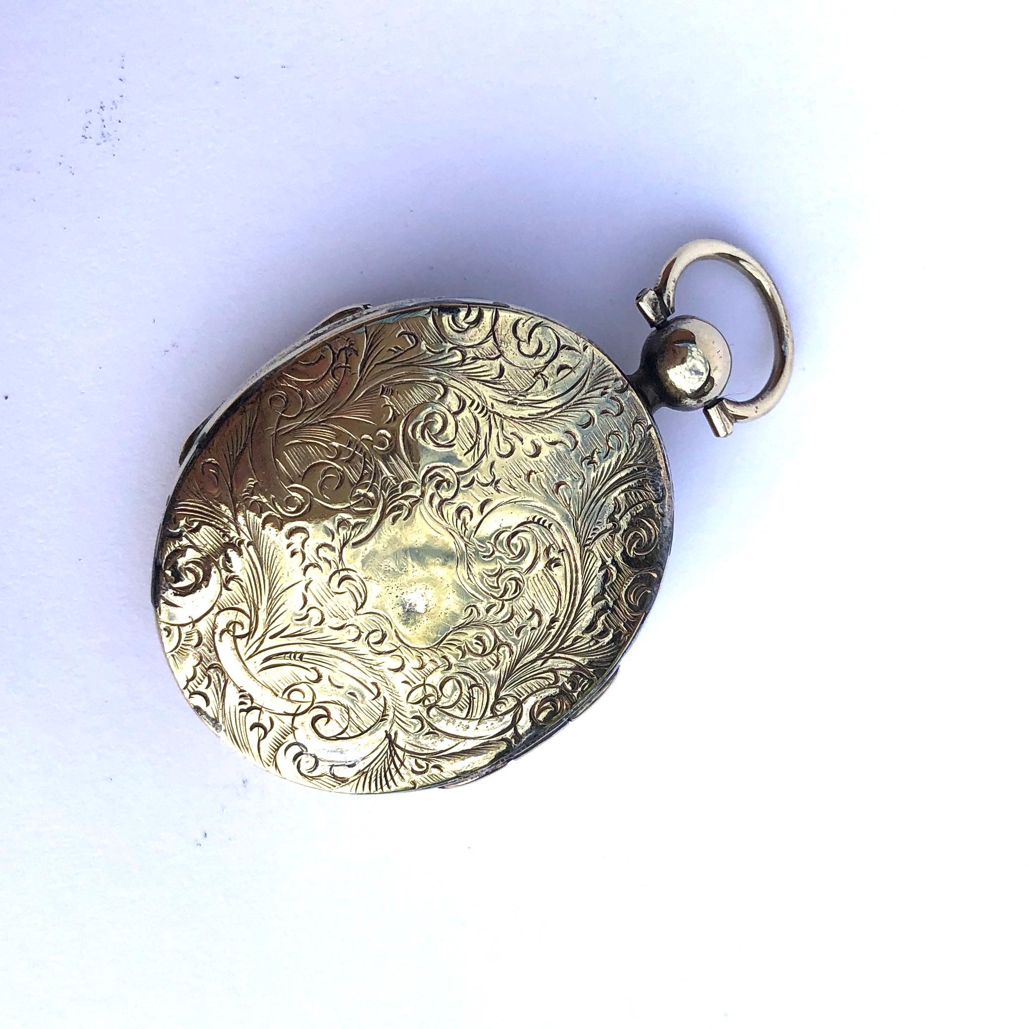 This sweetly engraved locket opens at the front and the back to reveal two separate compartments. The engraving has scroll and flower detail on both sides.

Dimensions Fron Loop: 46x27mm  

Weight: 19.7g