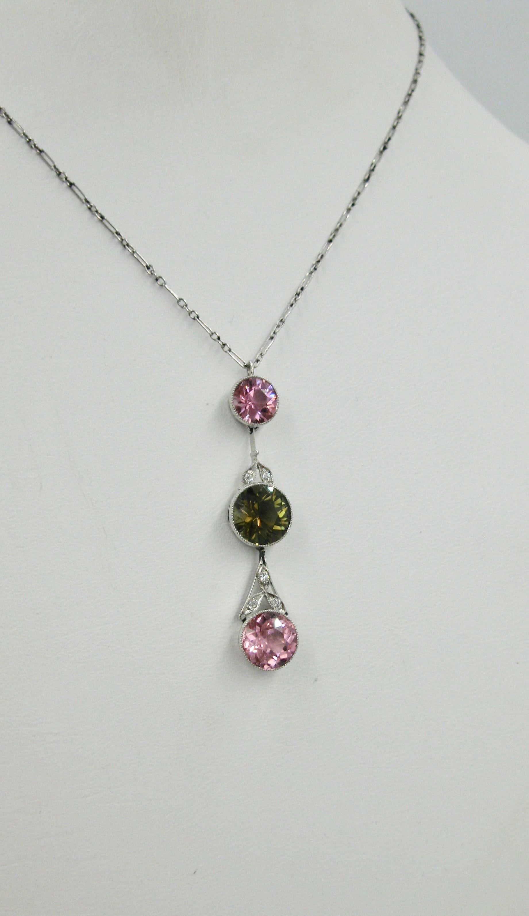 This is an exceptional and very rare Edwardian to Art Deco Necklace set with Pink and Green Tourmaline Gems of Great Beauty with Old European Cut Diamonds in a Platinum Pendant on a Platinum chain.  The combination of the pink and green tourmalines,