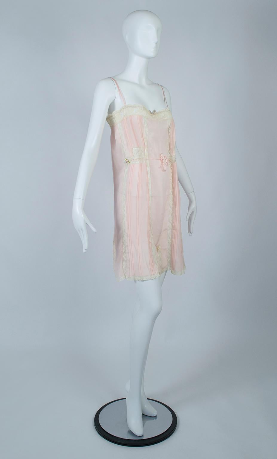 Though it looks and wears like a negligée, this wisp of a garment was an intermediate step between the chemise-style undergarments of the Victorian era and the separate bra and panties we wear today. Called “step-ins”, they made ideal sleepwear and