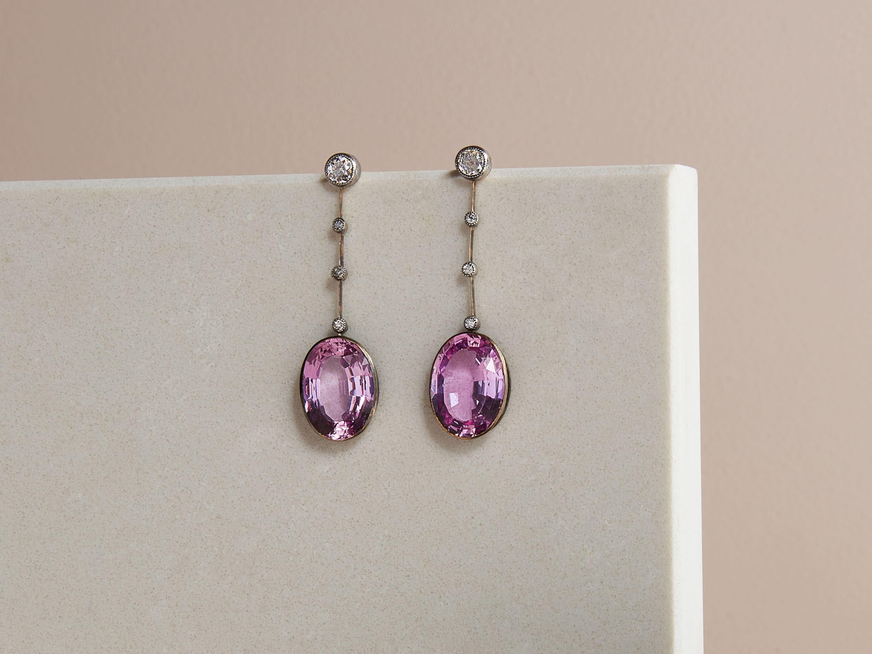 Genuine rarity and breathtaking beauty best describe these Belle Époque earrings featuring a pair of perfectly matched cyclamen coloured pink topaz.
Topaz is found in a variety of colours. But, the rarest and most coveted are pink, fine golden