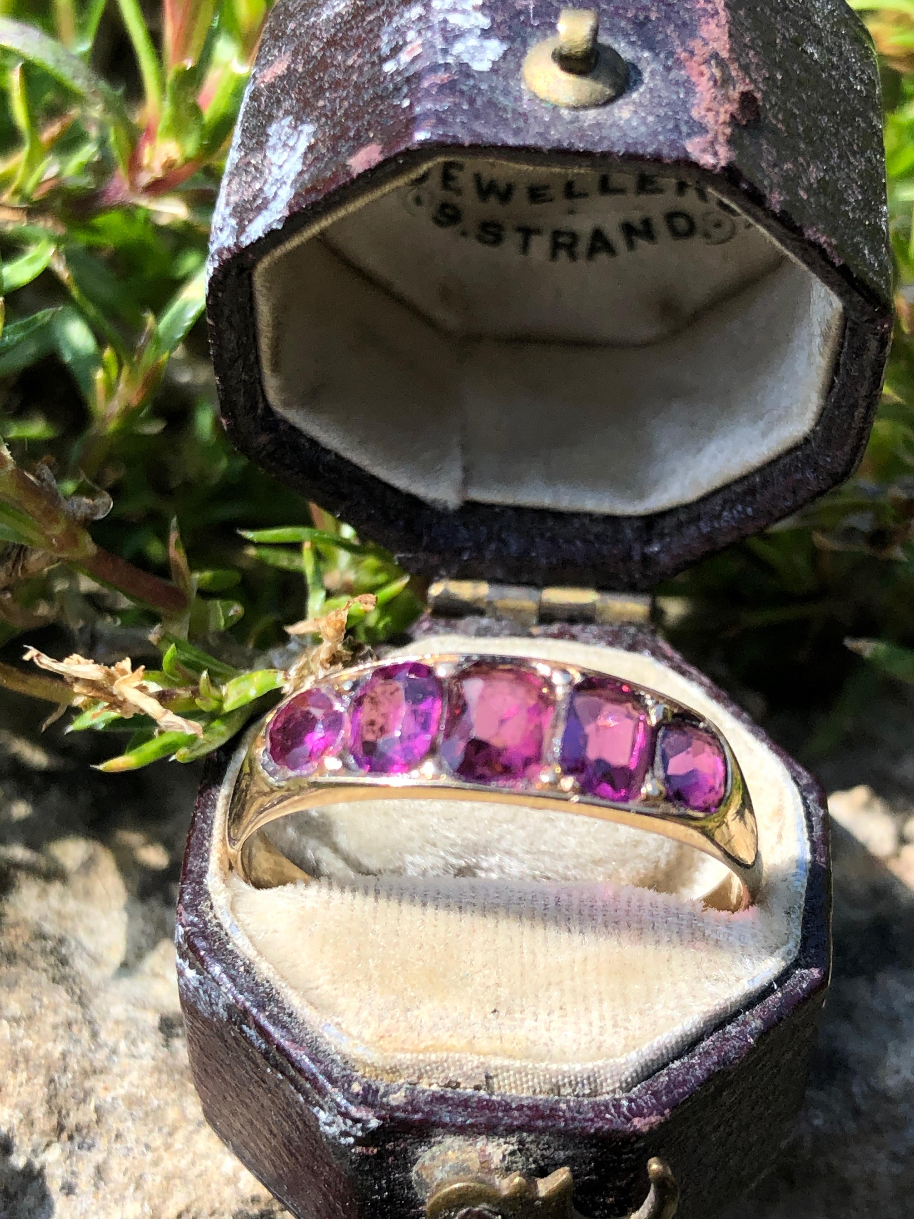 This stunner holds five deep pink tourmaline that are beautifully cut and catch the light just right to get that sparkle. They are set almost flush within the 9ct gold band. 

Ring Size: Q 1/2 or 8 1/2
Band Width: 5mm

Weight: 2g