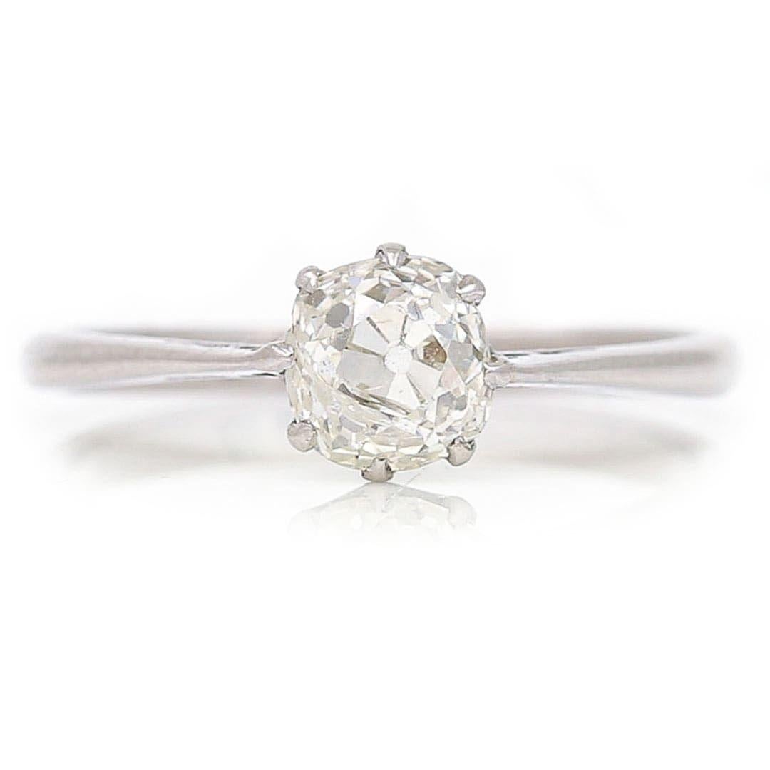 A beautiful antique 0.95ct old mine cut diamond single stone ring set in platinum made in the early 20th century. Presented in a timeless coronet claw setting this brilliant diamond would make for a dream engagement ring. This super solitaire was